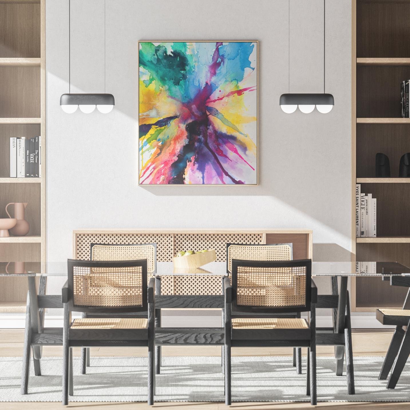 The vibrant artwork is mounted in a dining room with cane-back chairs and a modern pendant light, adding energy and movement to the sophisticated space.