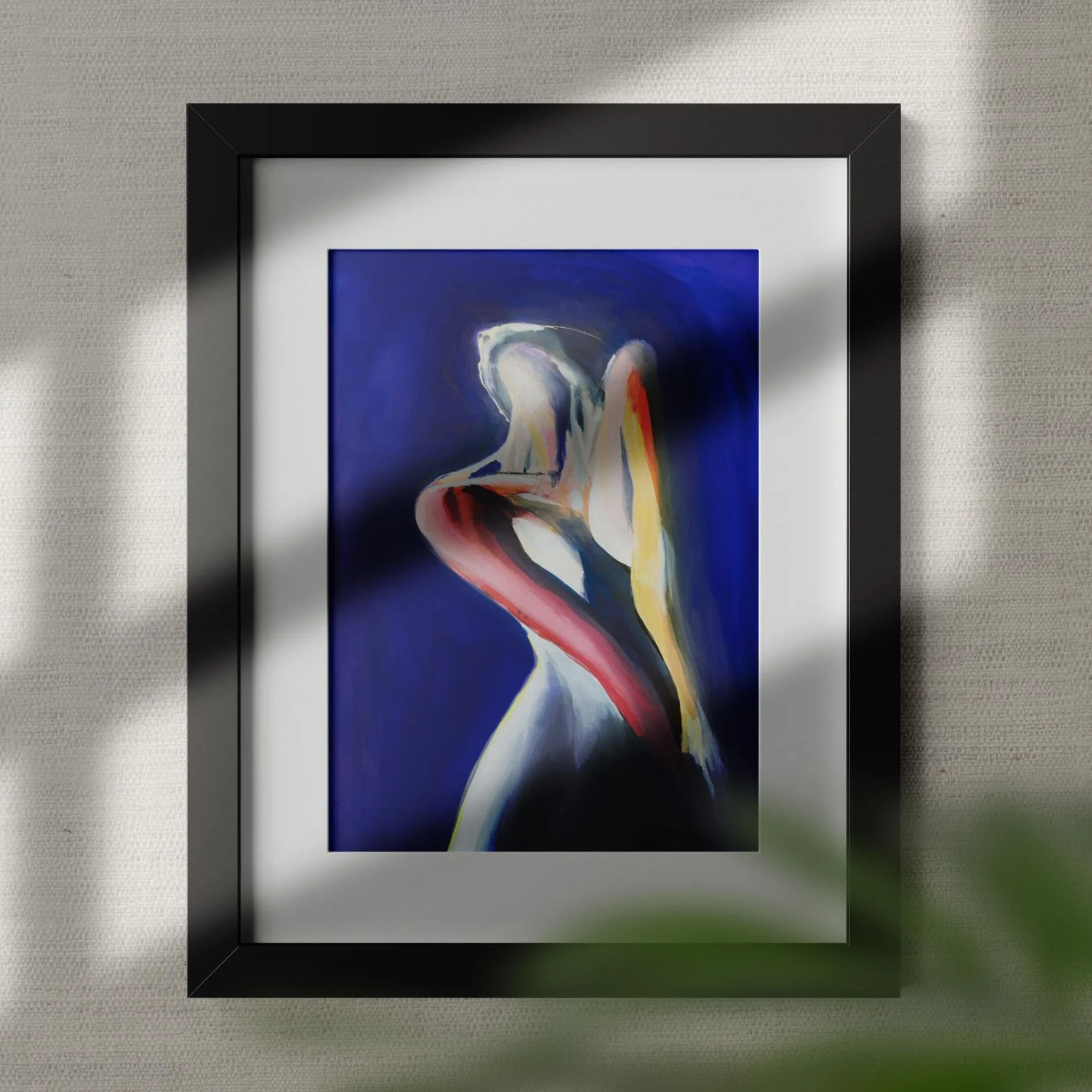Abstract painting of a nude female figure in flowing red, yellow, and white strokes on a deep blue background, framed with a white mat and black frame.