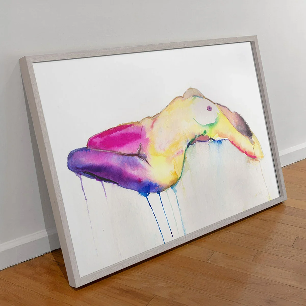 Colorful watercolor nude reclining figure painting in a modern frame leaning against a wall by artist Nick Horvath.