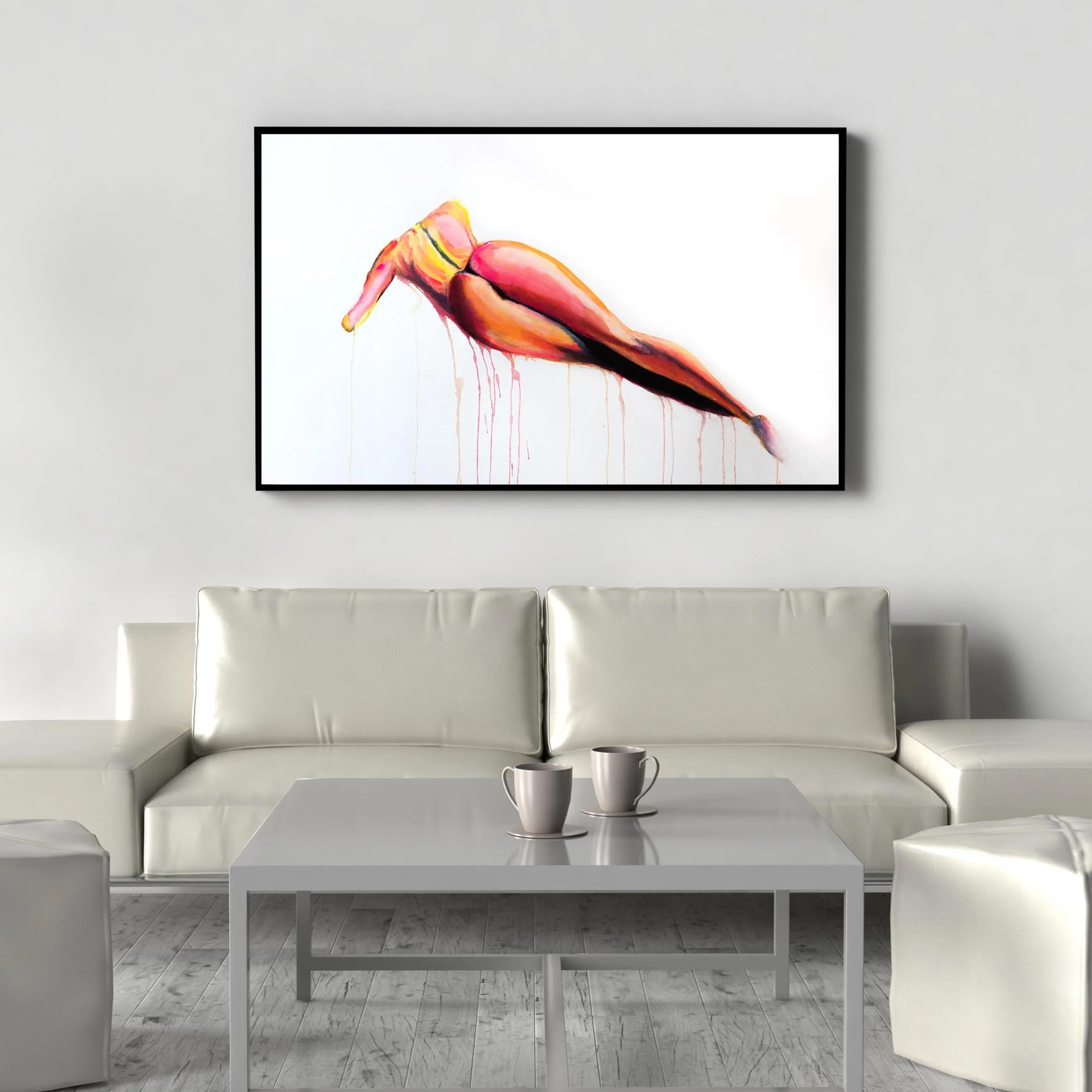Vivid watercolor nude framed in black and showcased above a sleek white leather couch, infusing the minimalist room with color and bold expression.