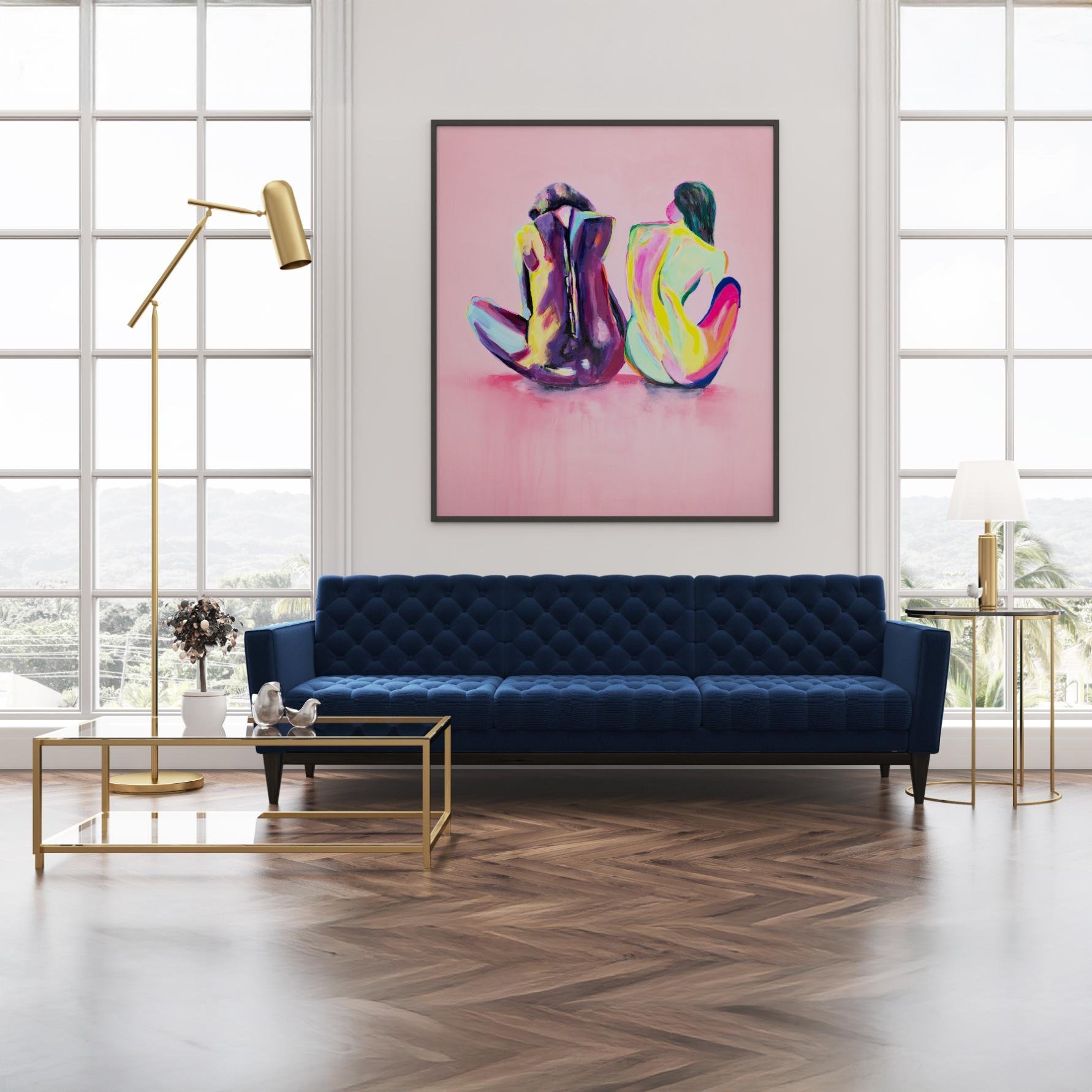 Large “Friends” painting centered in a high-ceilinged modern room with a navy couch, brass accents, and full-window views of nature.