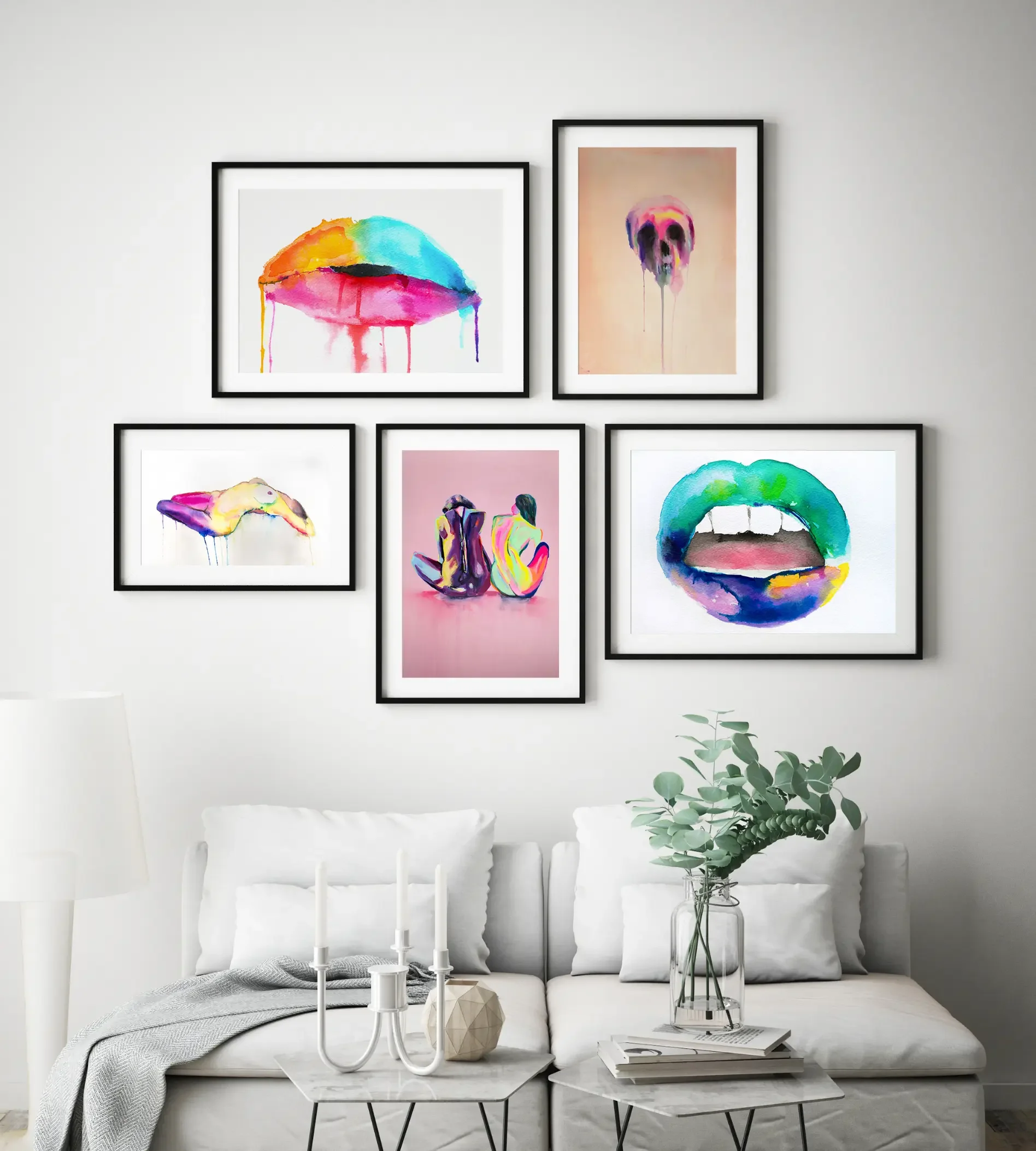Gallery wall featuring colorful watercolor artworks including lips, skull, and nude figures displayed above a modern living room sofa by artist Nick Horvath.