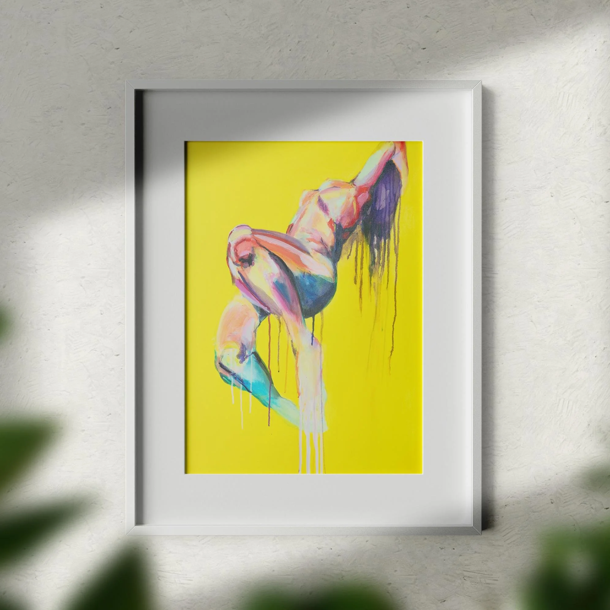 Framed Skyfall print on a white wall with natural lighting, emphasizing the dripping colorful nude over a yellow background.