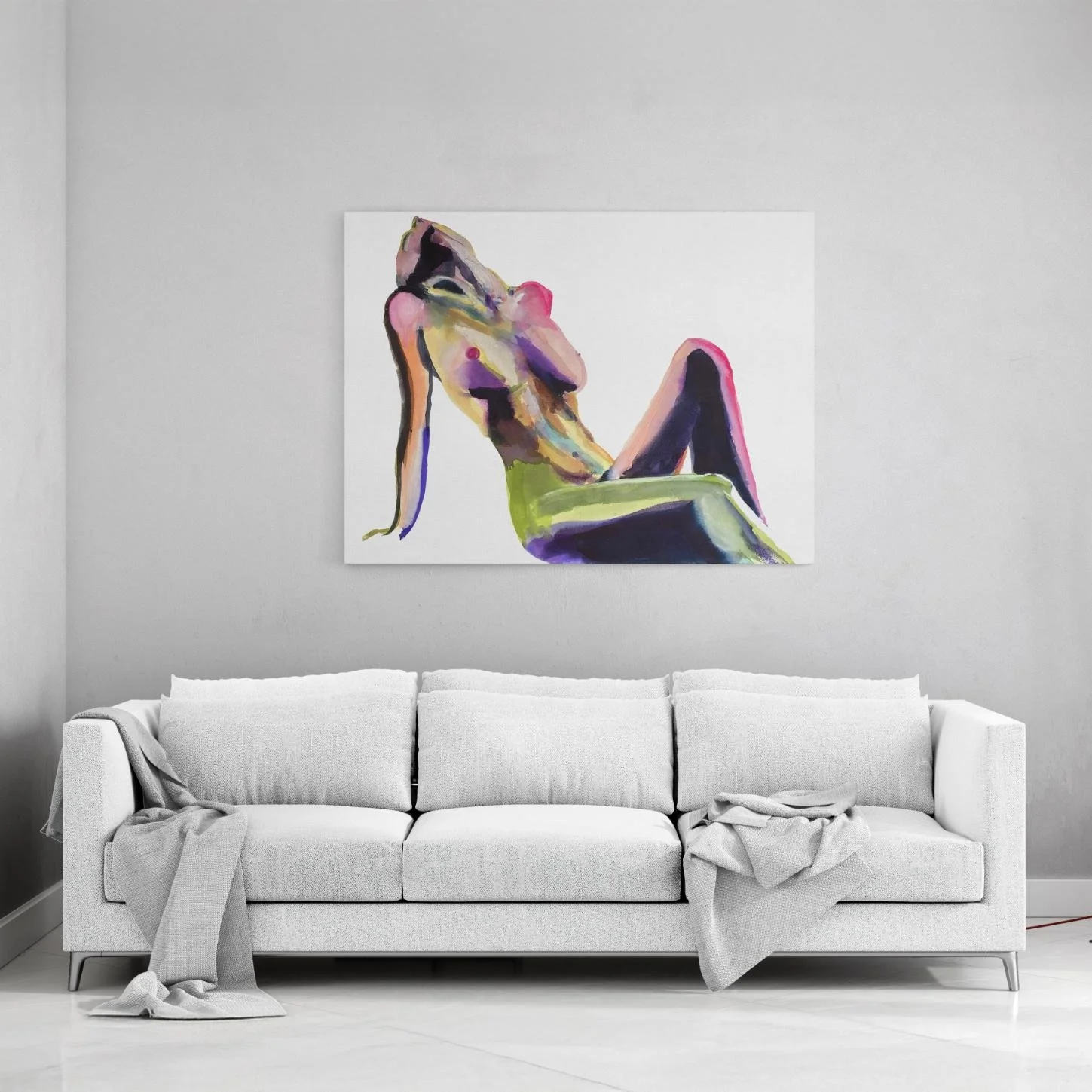 Large-scale artwork of a reclining nude glows in purples, greens, and pinks, making a bold statement above a clean white sofa in a bright room.