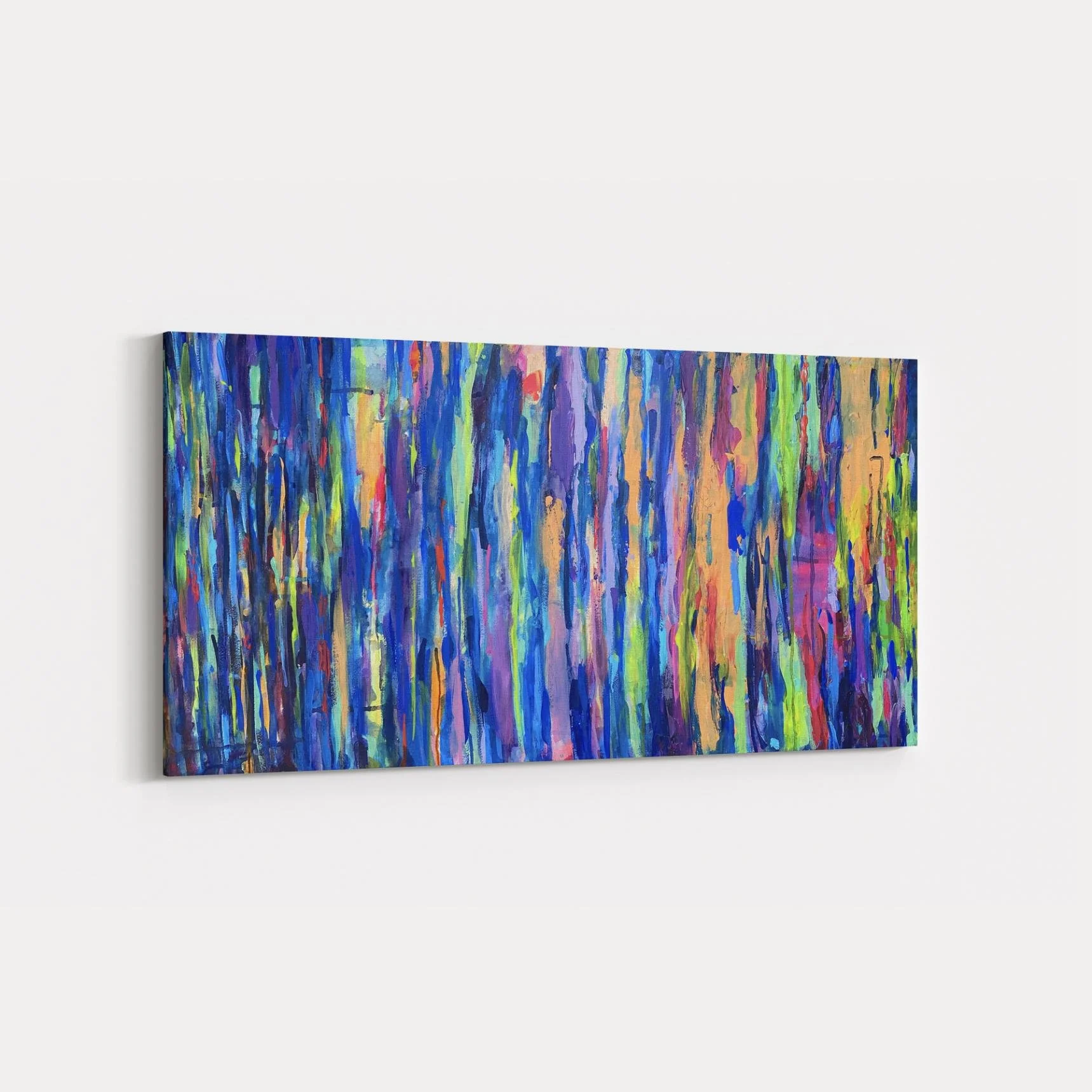Angled view of “Shimmer” against a bright white wall, emphasizing the depth, texture, and vibrancy of its multicolored vertical strokes.
