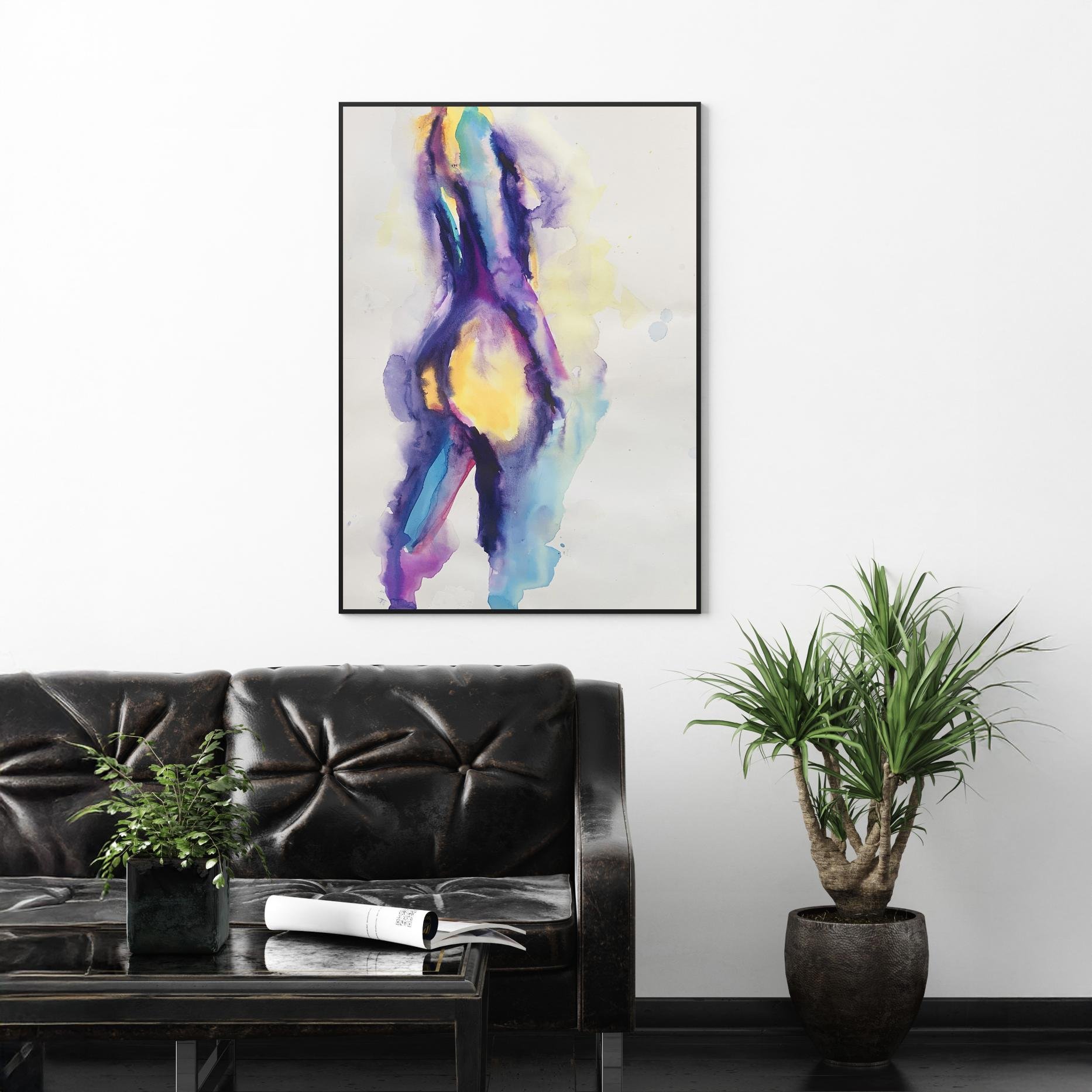 Framed painting hangs above a black leather sofa with tufted cushions and a glass coffee table, framed by plants in a clean modern living room.