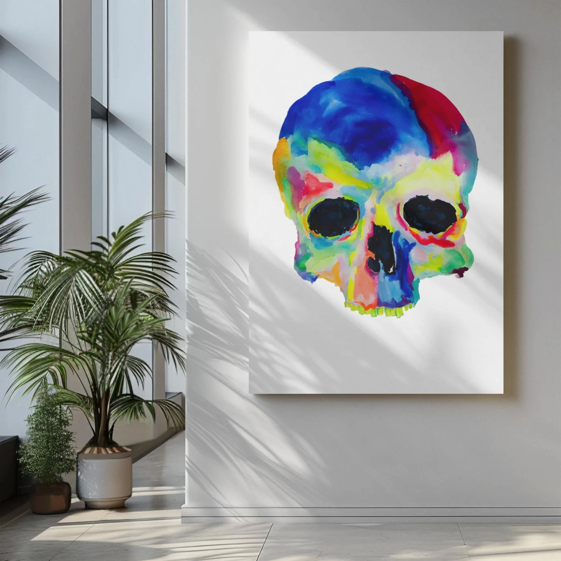 Skull artwork on a tall white canvas in a modern, sunlit corridor with glass windows.