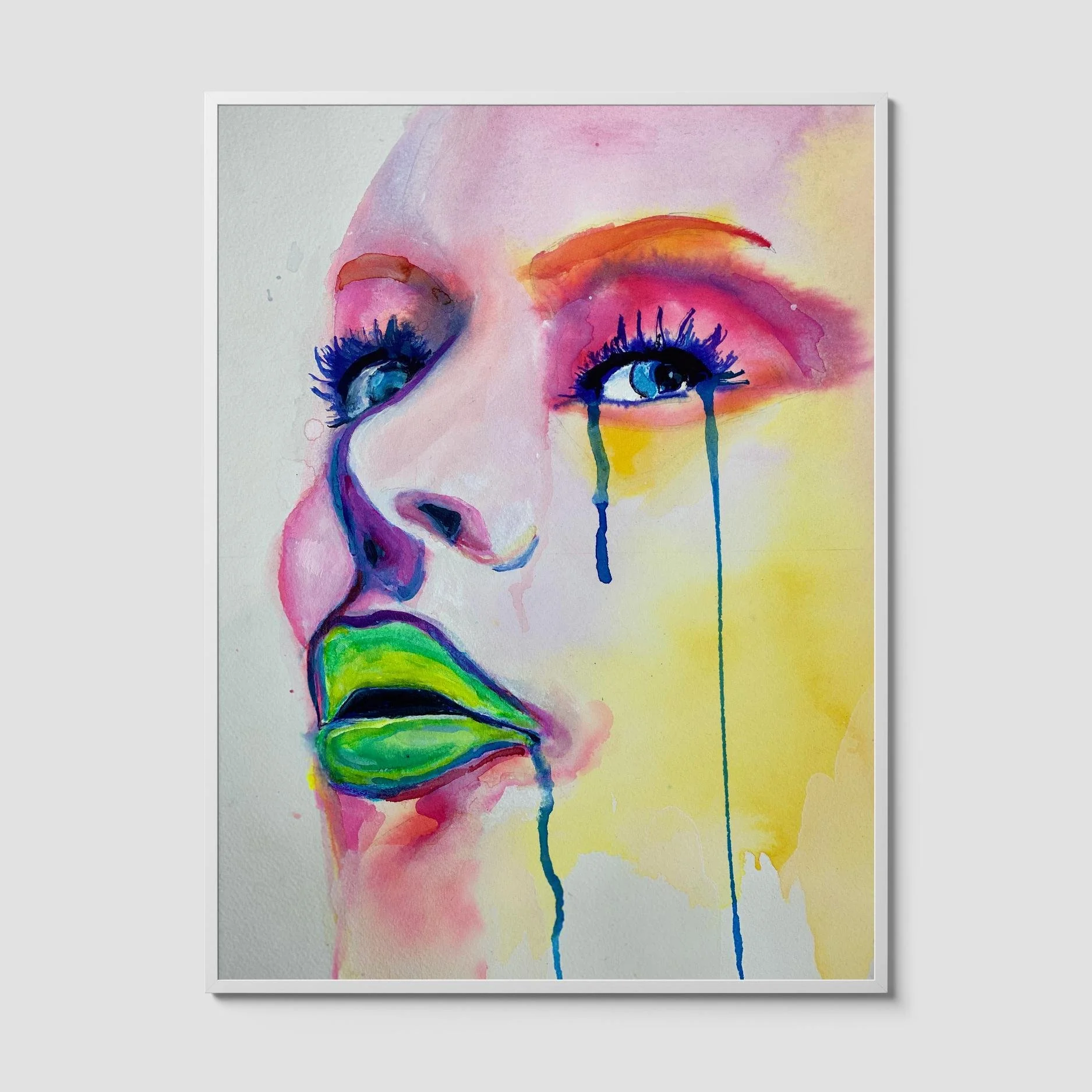 Colorful watercolor portrait art print of a woman’s face with green lips and dripping blue tears in bold pink, yellow, and orange tones