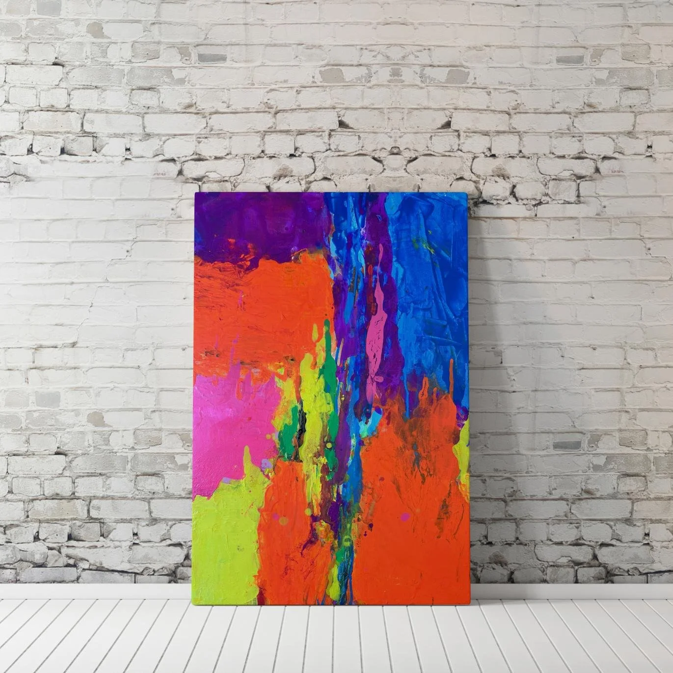 Large-format "Fusion" painting propped against a white brick wall, showcasing bold abstract color transitions and textured paint strokes.