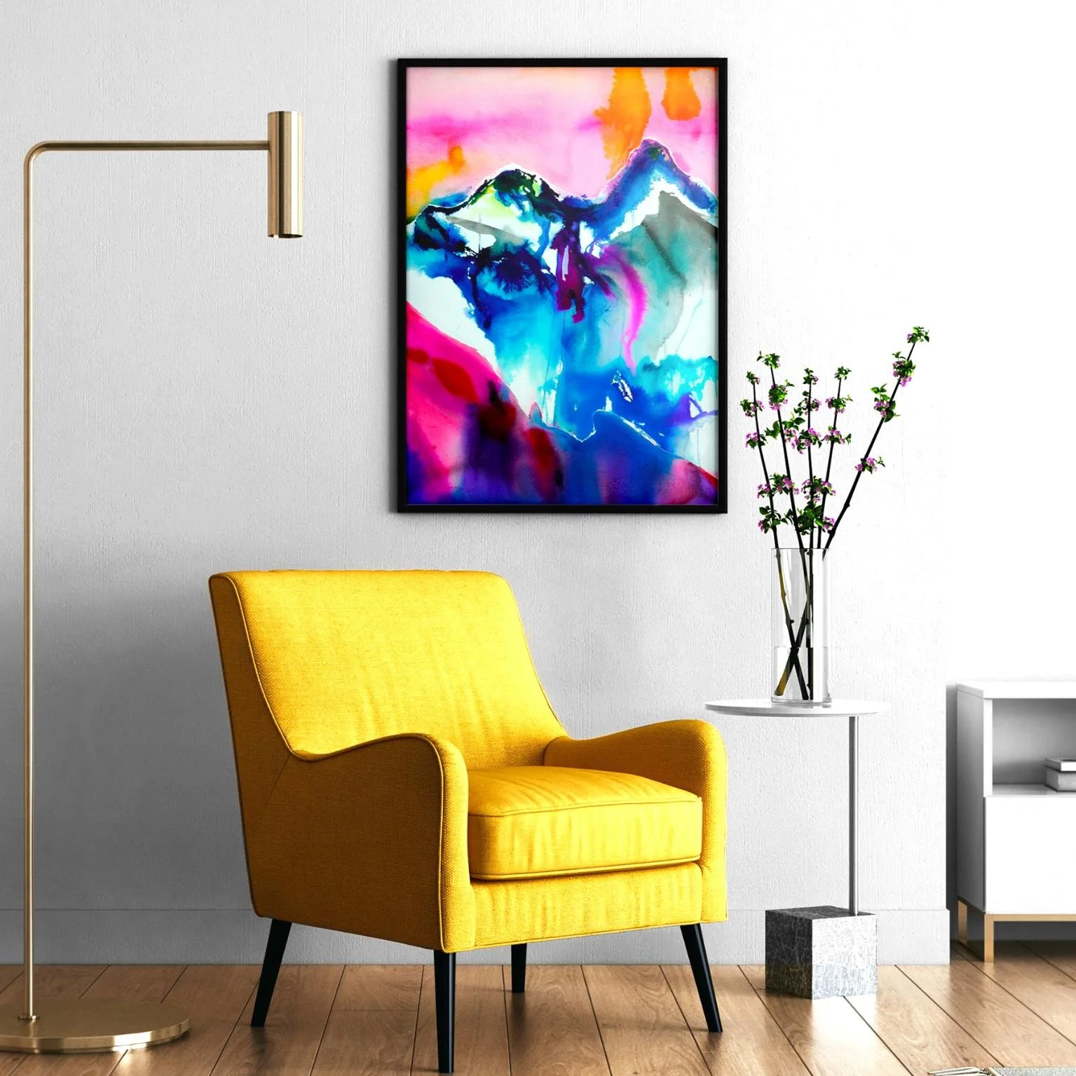 "Glory Mountain" framed in black and hung above a yellow accent chair, adding a burst of color and energy to a modern minimalist interior.