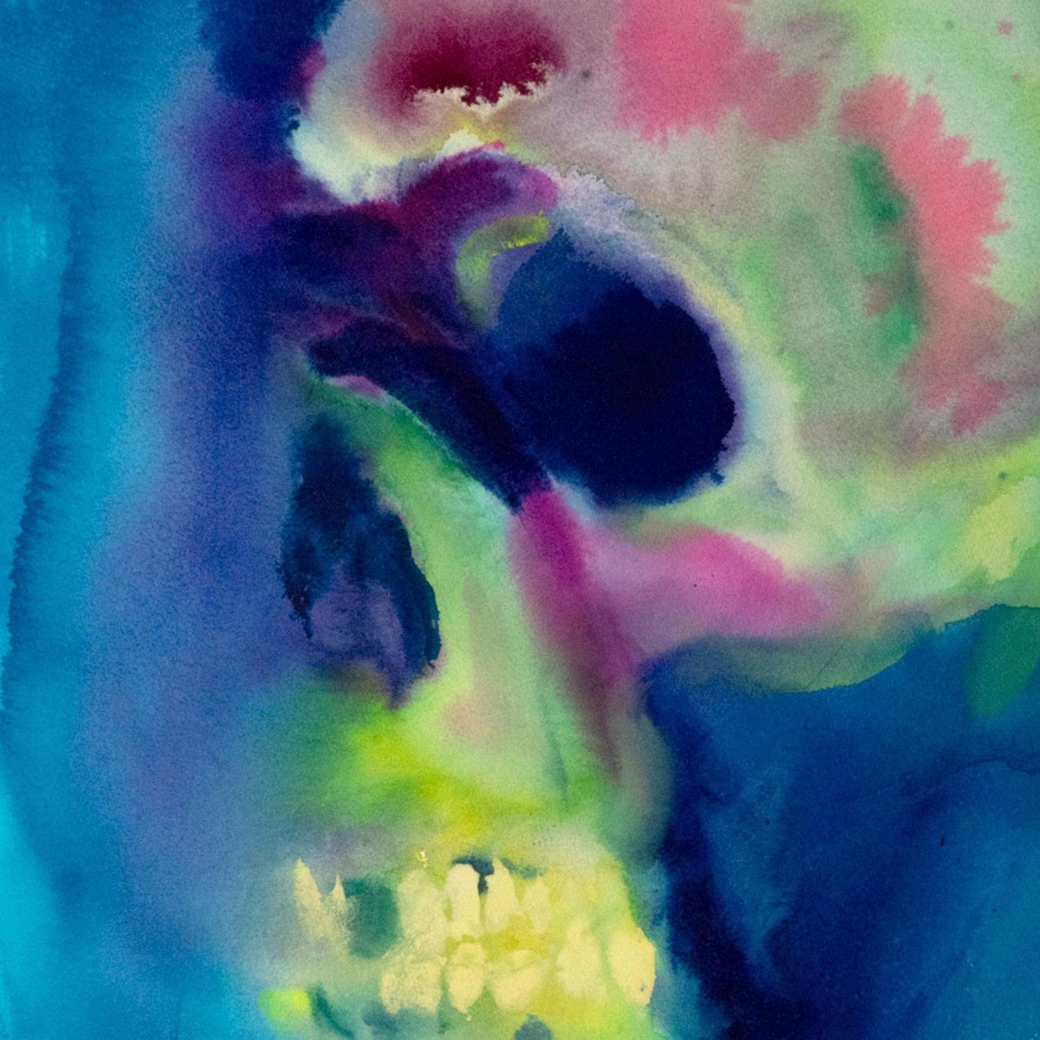 Dreamlike skull emerges in glowing blues, purples, and lime green tones, as if floating underwater in soft light.
