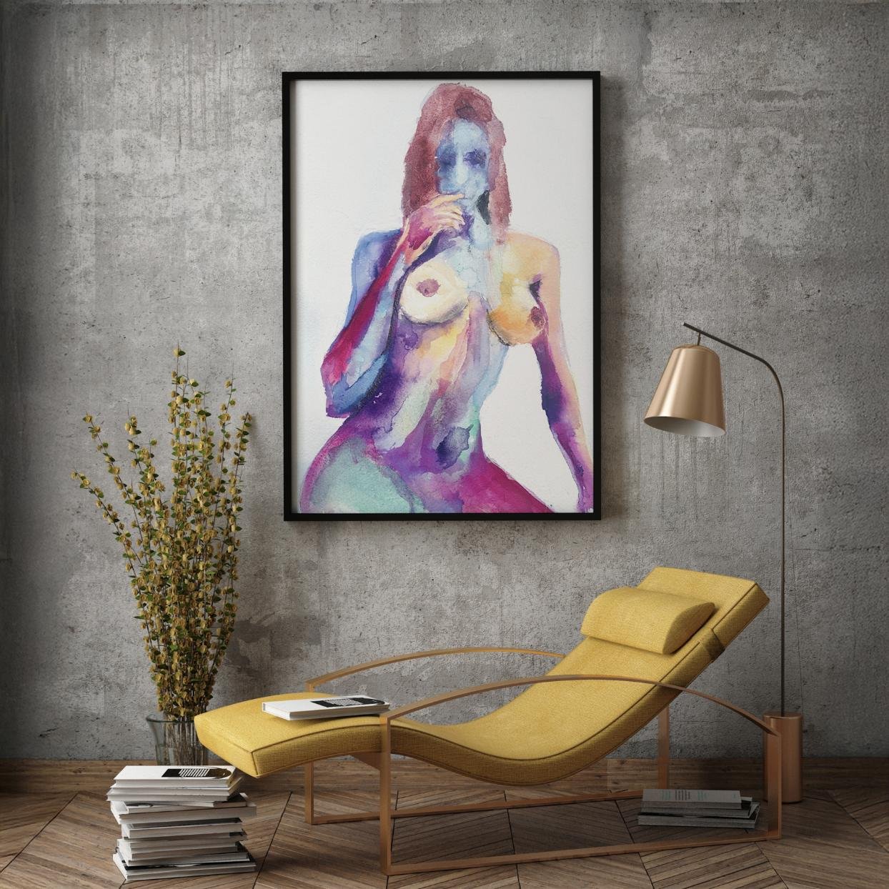 Framed abstract nude painting titled Eager in a cozy modern reading nook with concrete walls, wooden flooring, and a yellow lounge chair.