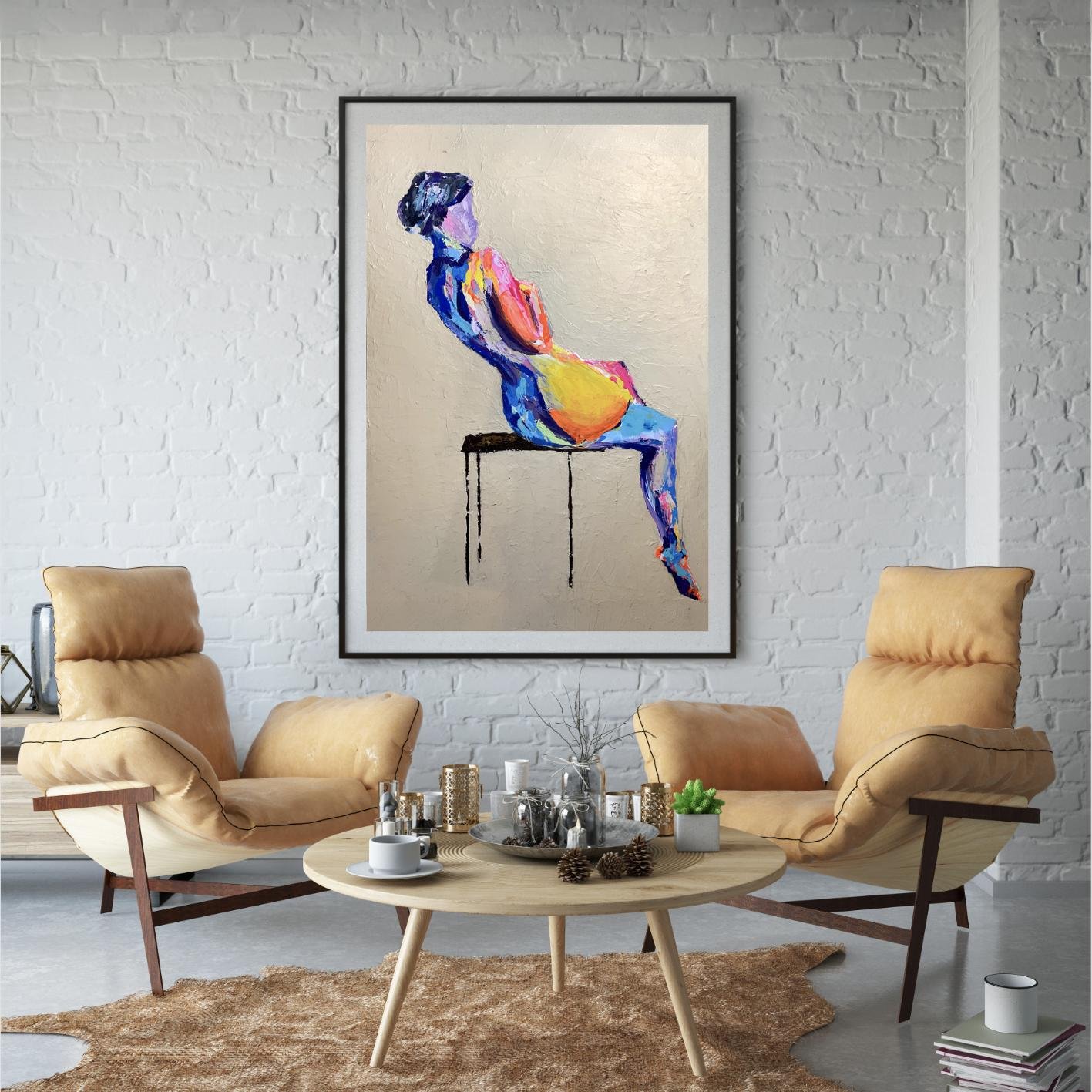 Painting featured in a cozy lounge with light brick walls and tan leather chairs, blending bold color with a relaxed, contemporary setting.