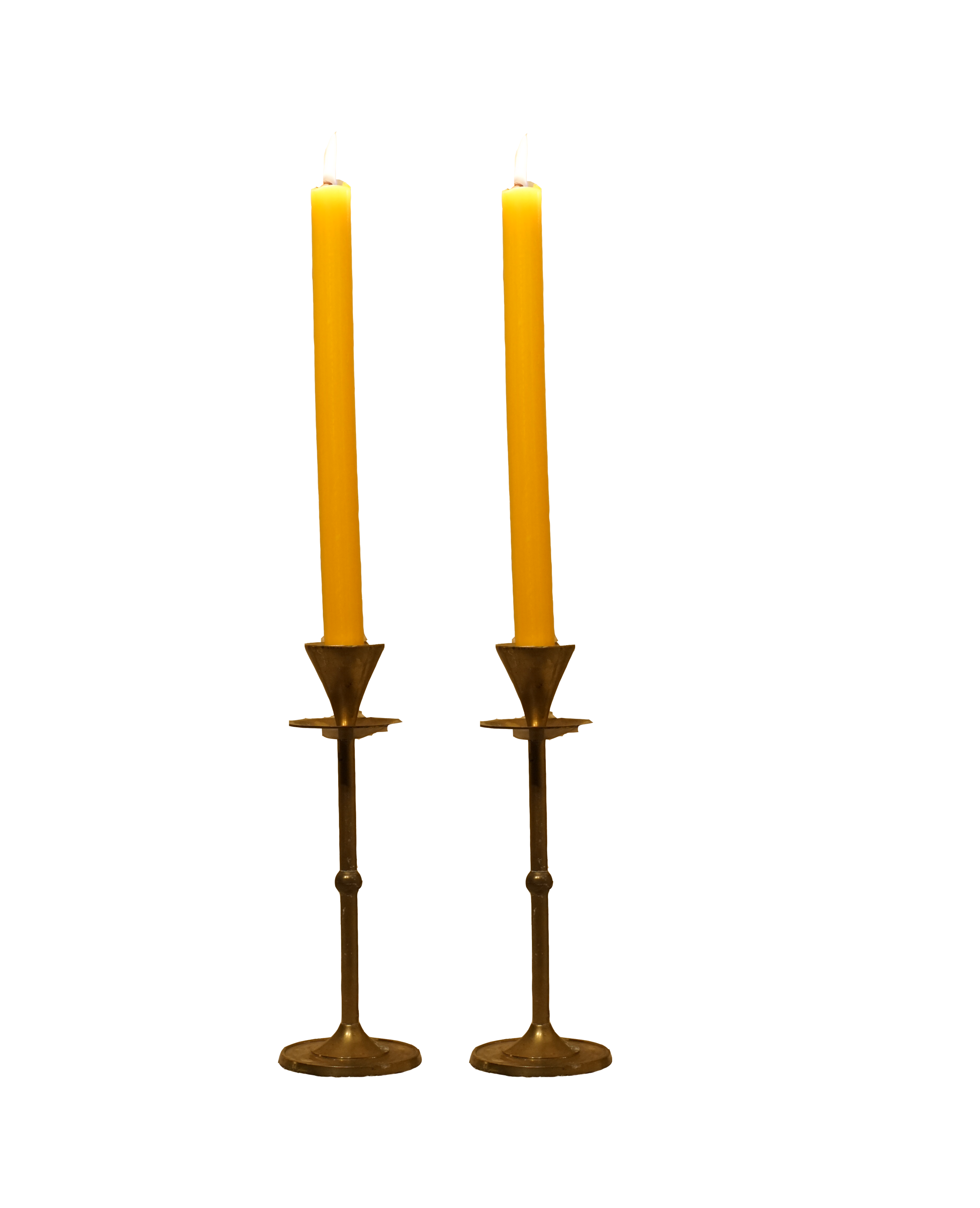 A brass candelabrum with two lit yellow candles.
