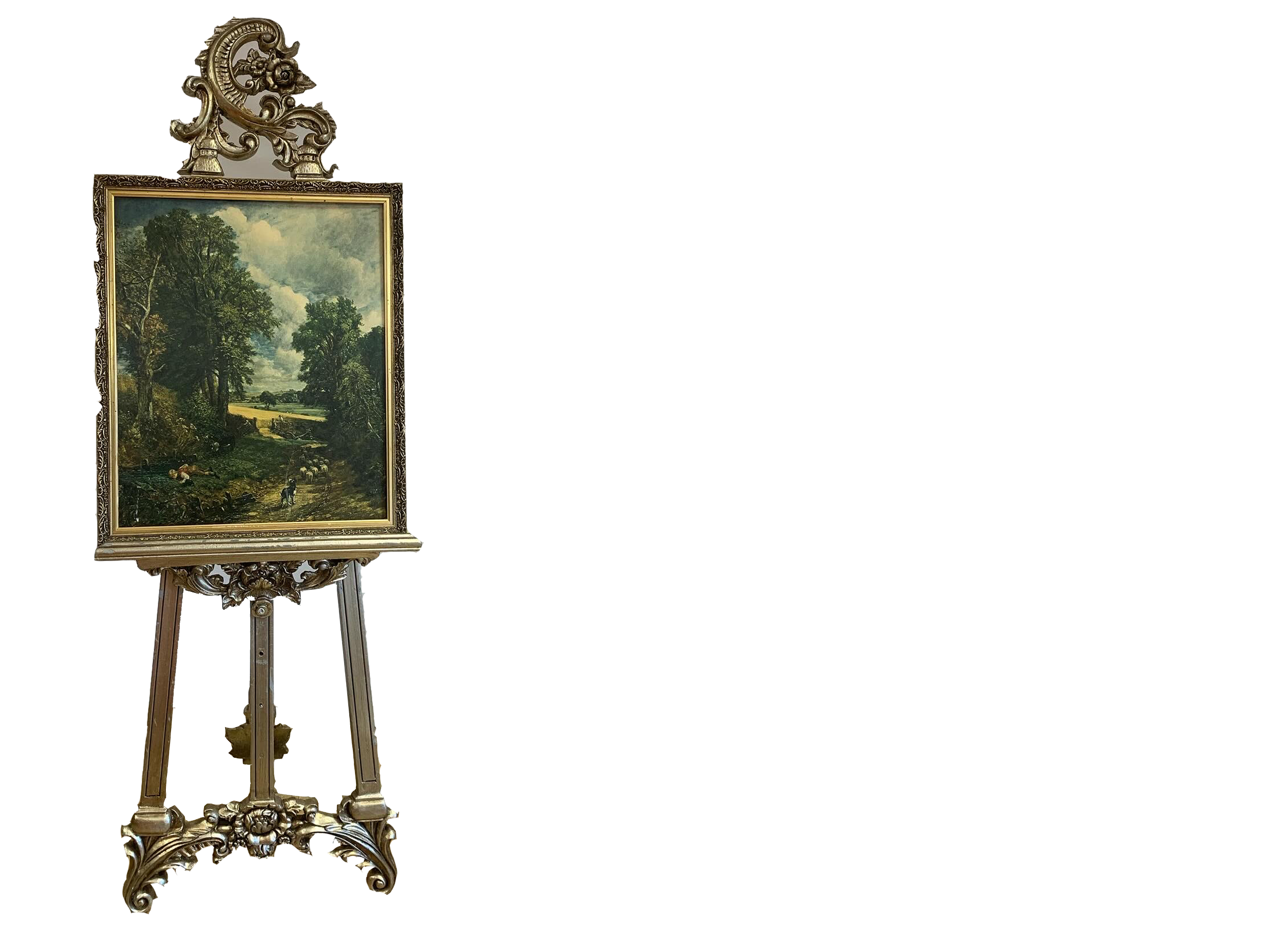 An ornate gold frame on a stand displaying a landscape oil painting of a rural scene with trees, clouds, and a few people and animals on a path.