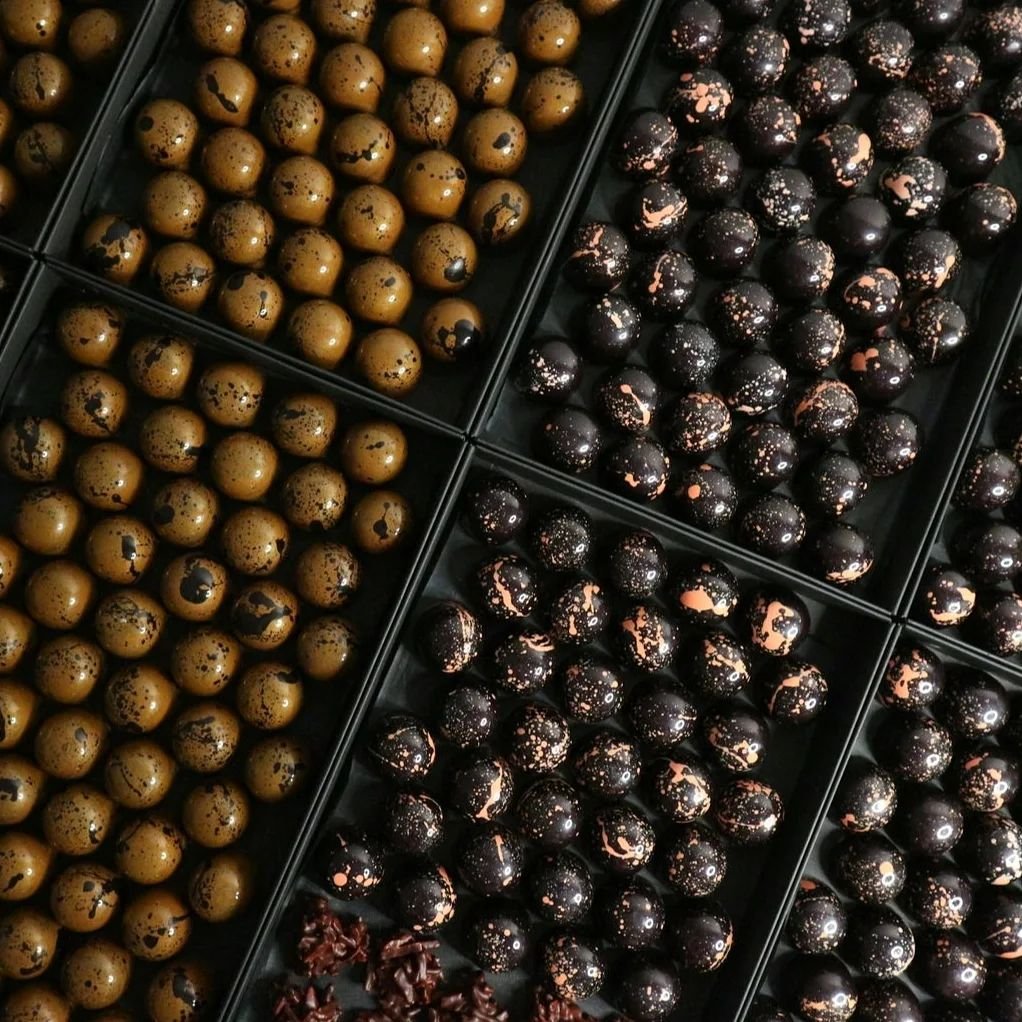 Adixions Handcrafted Chocolate Bonbons are a minimum 3-day process: 

1. The chococlate moulds are hand-polished to assure that shine. 
2. We then hand-paint the chocolate moulds with coloured cocoa butter we have carefully tempered, this has to set.