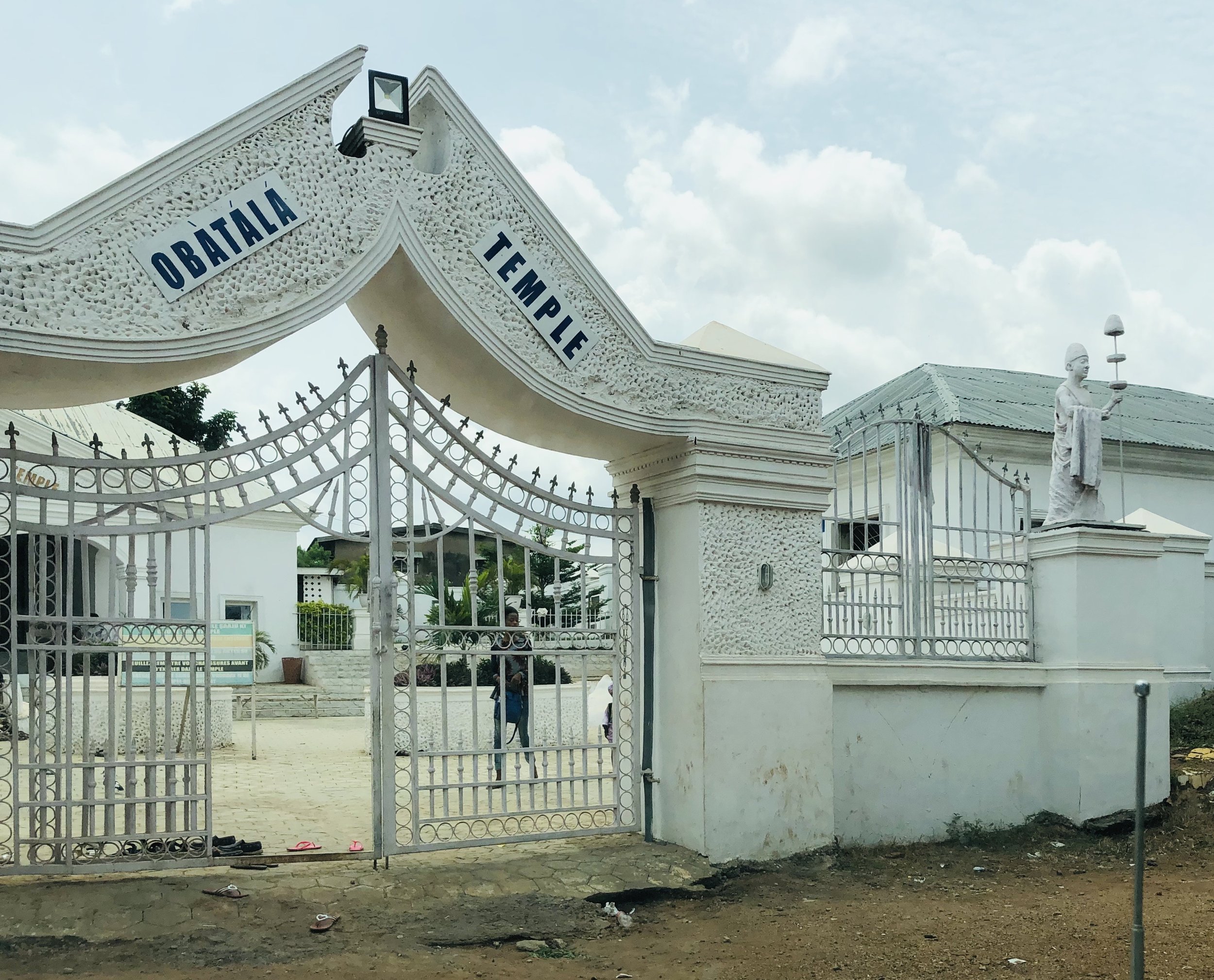 Entrance to the Obàtálá Holy Temple in Ilé-Ifẹ̀, Nigeria—the spiritual center of the Obàtálá tradition and the site where I was formally conferred the title of ObaRisa Obàtálá of America. This sacred temple remains an important place of pilgrimage, c