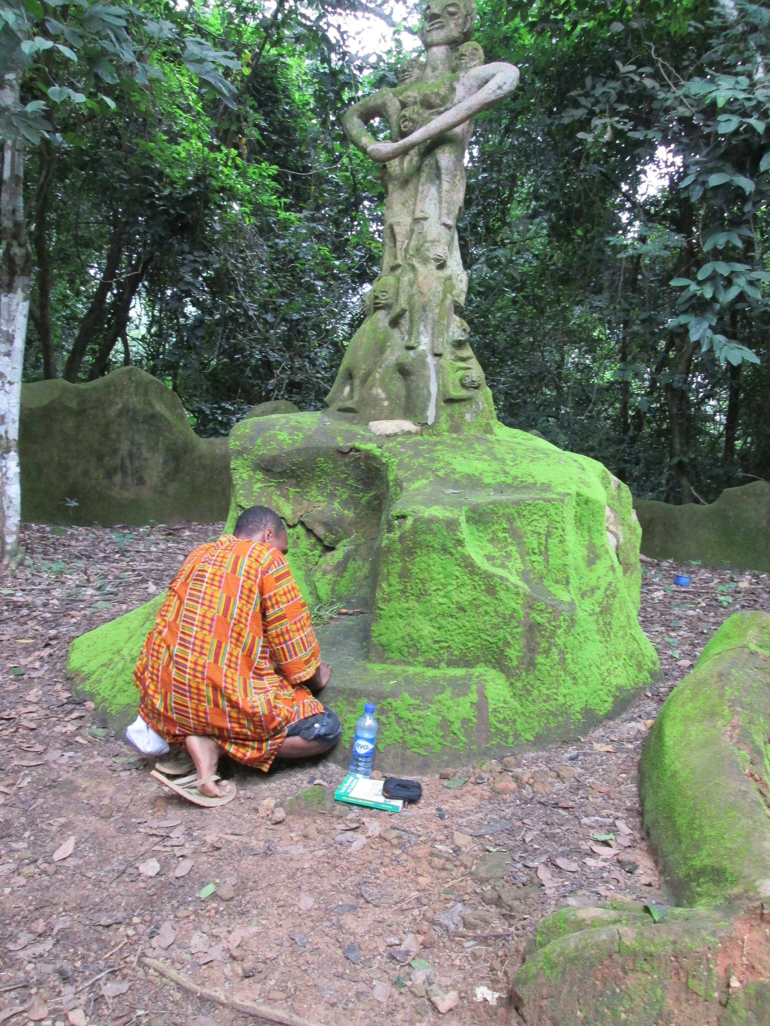 Offering prayers at the Ojúbọ Òṣun within the Sacred Òṣogbo Grove, a UNESCO World Heritage Site in Òṣogbo, Nigeria. This sacred pilgrimage reflects my lifelong commitment to honoring the Òrìṣà traditions and preserving the living spiritual heritage o