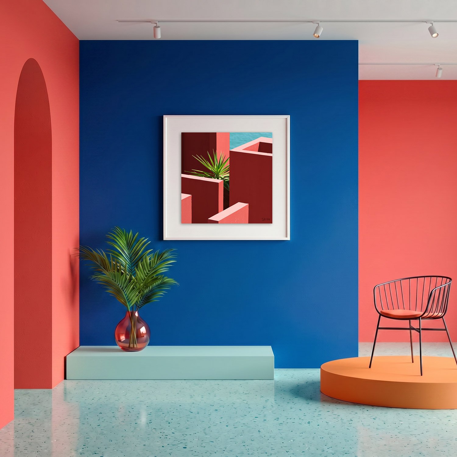 Muralla Roja 17 framed photography print in bold cobalt blue and coral gallery interior