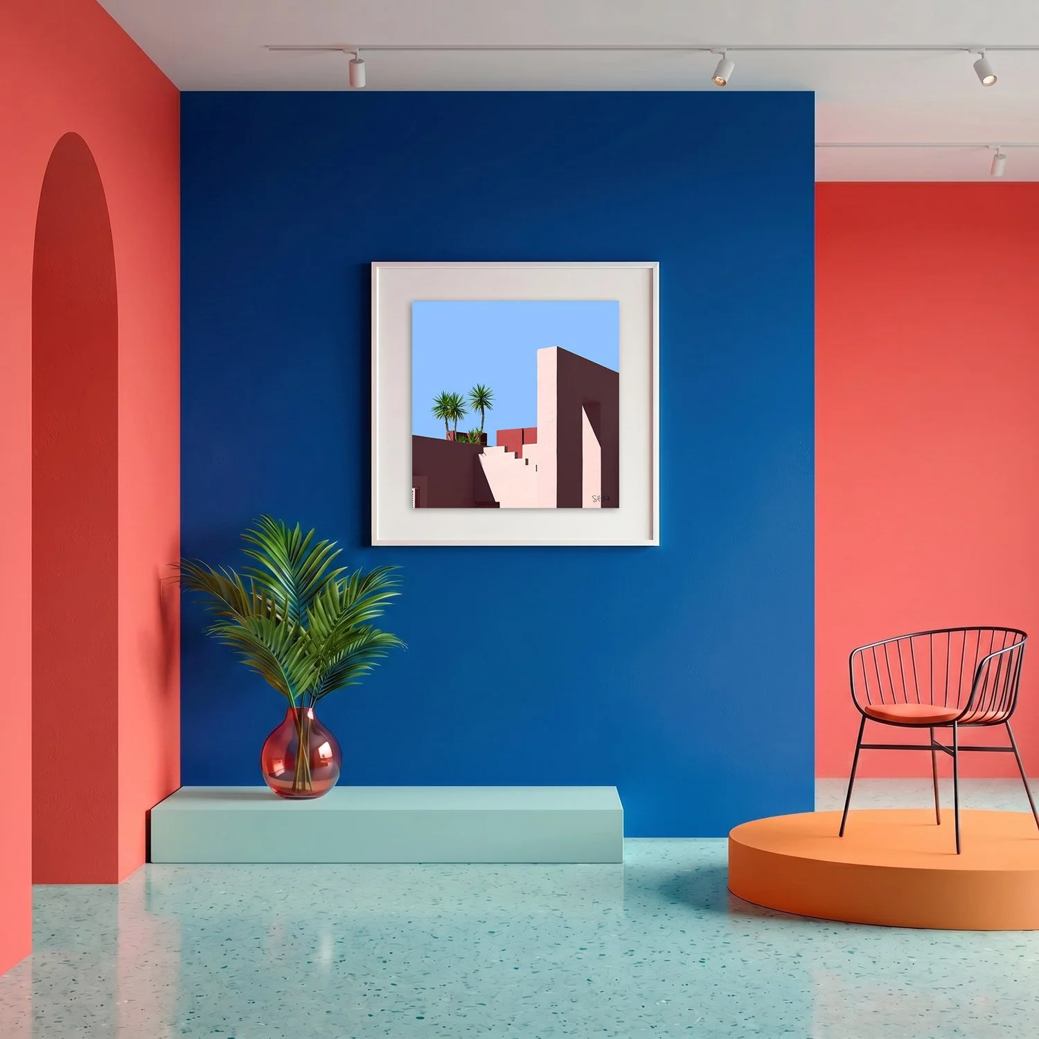 Muralla Roja 15 framed photography print in bold cobalt blue and coral gallery interior