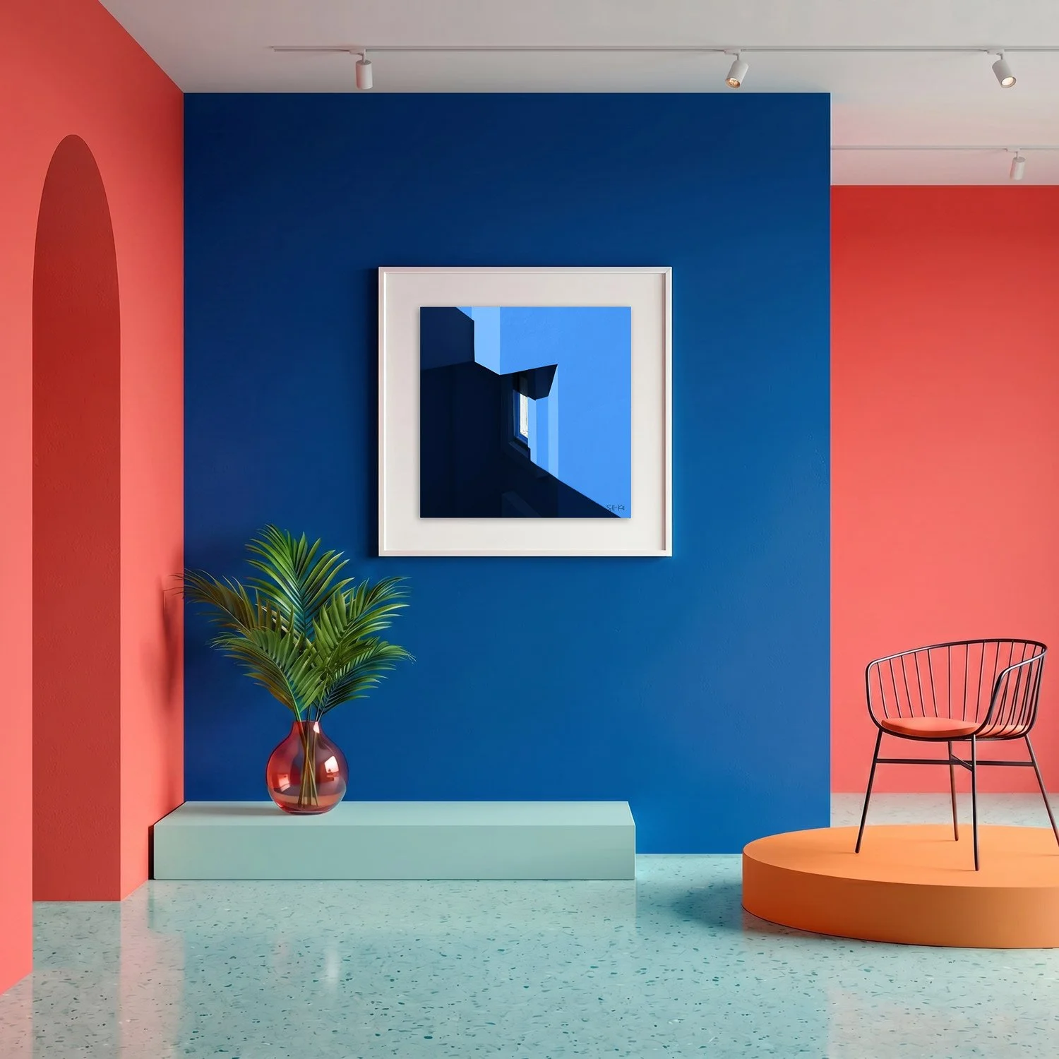 Muralla Roja 14 framed photography print in bold cobalt blue and coral gallery interior