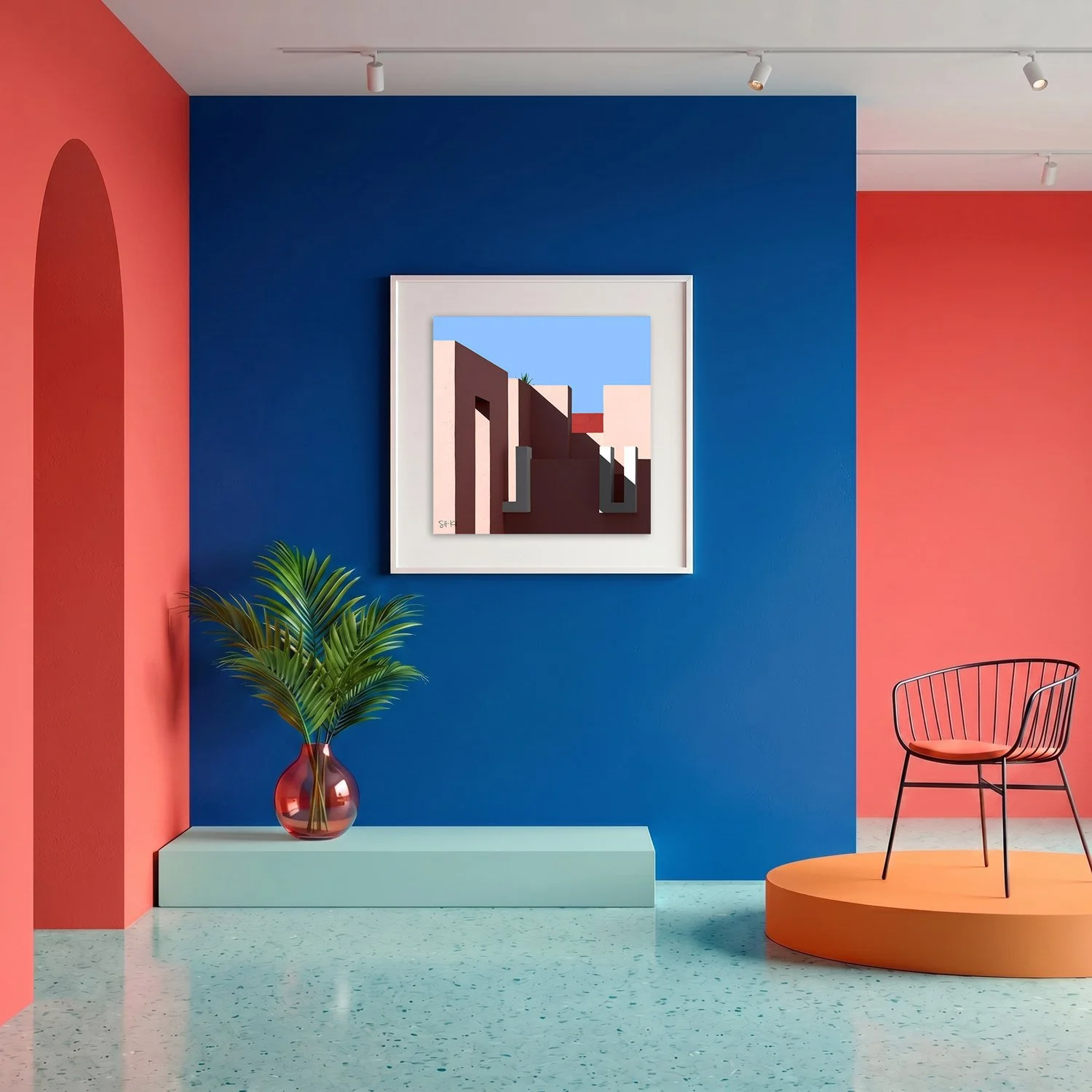 Muralla Roja 24 framed photography print in bold cobalt blue and coral gallery interior