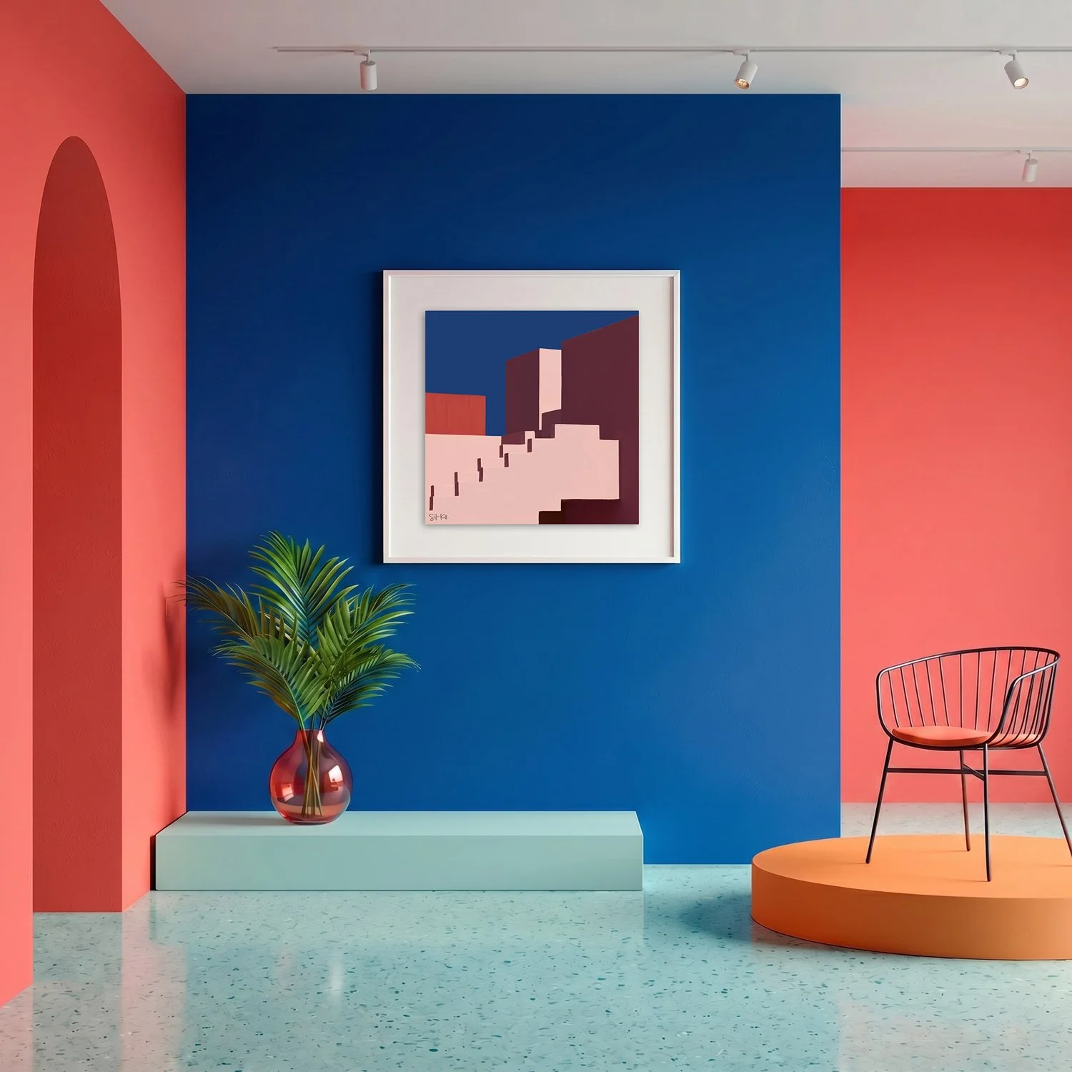Muralla Roja 10 framed photography print in bold cobalt blue and coral gallery interior