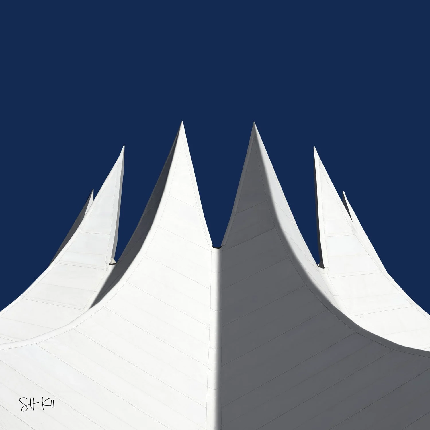 Five tensile membrane peaks in sun and shadow against cobalt sky — Neues Tempodrom, Berlin photograph