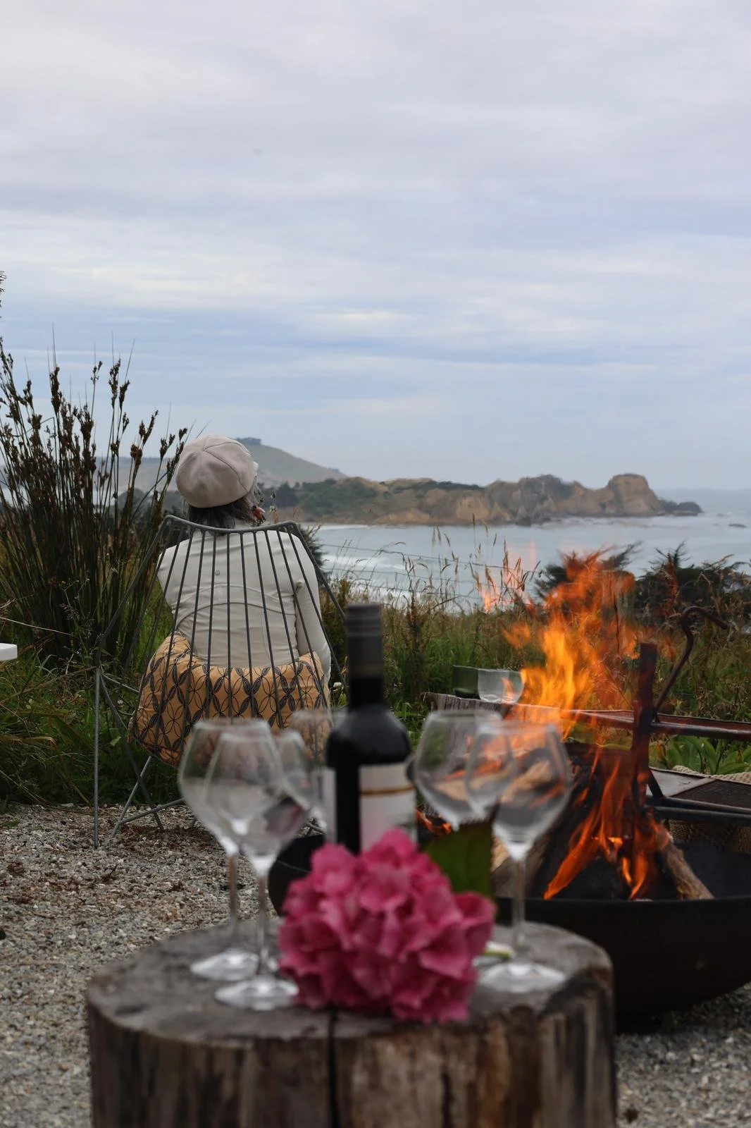 Enjoy slow evenings around the firepit and views over the ocean - Book your stay at The Longhouse Tirimoana