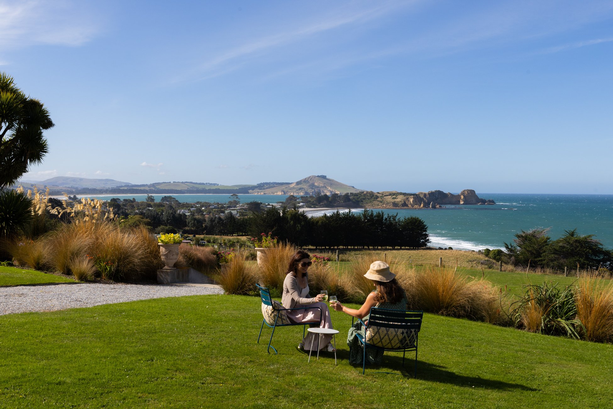 The Longhouse : Drinks on the lawns overlooking the ocean.jpg