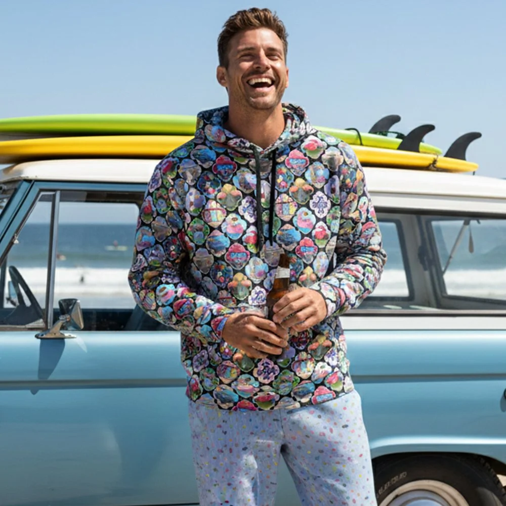 man in frontof car. Hamptons Hippie unisex daytripper pullover hoodie, made from sustainable materials