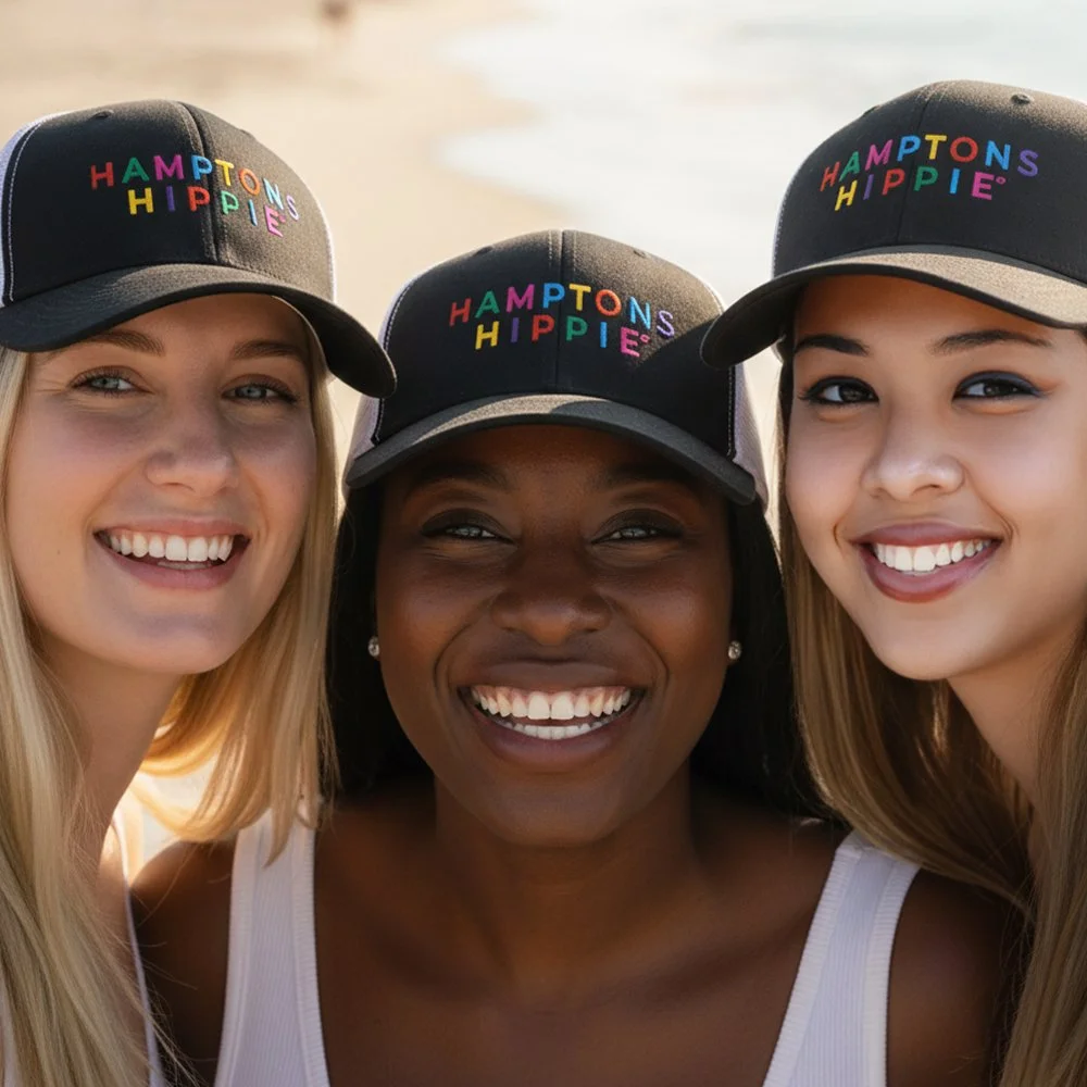 Hamptons Hippie mesh back trucker hat with the iconic HH logo, perfect for beach style. 3 women