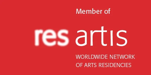 Red background with white text reading "Member of resartis WORLDWIDE NETWORK OF ARTS RESIDENCIES."