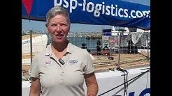 Dr Dianne McGrath standing on the pontoon next to PSP Logistics at Portsmouth