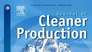 Cover image of the Journal of Cleaner Production with a snow capped mountain visible behind a forest