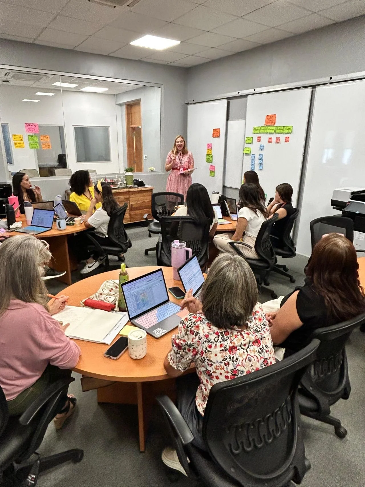 Teenager wearing a backpack holds books and uses headphones 