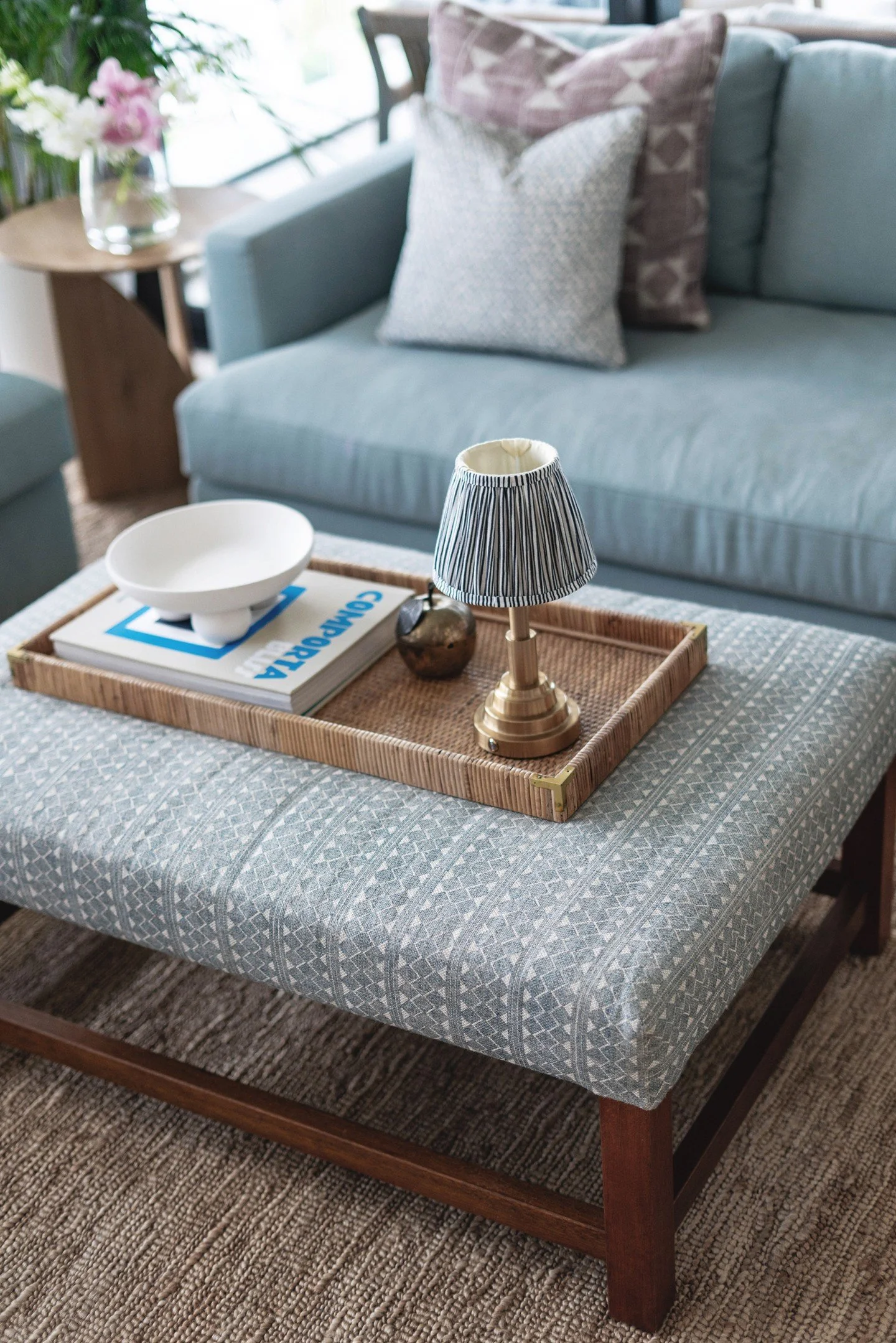 TGH Style File / Tomlinson Road Project: A cosy TV snug designed for family moments and movie marathons in this modern condo. 🎬✨

Custom-made sofas, layered with @fermoie cushions and a patterned ottoman, bring texture and comfort, all anchored by a