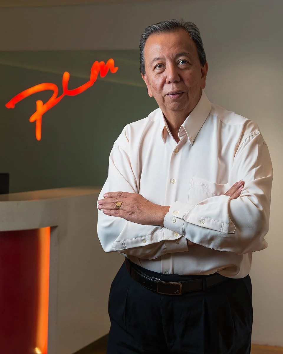editorial corporate portrait in front of company logo