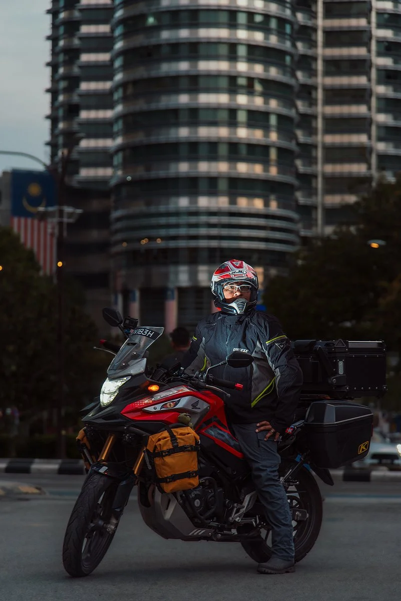 Portrait of Chegu Thamrin and his Bike in front of the Petronas Towers