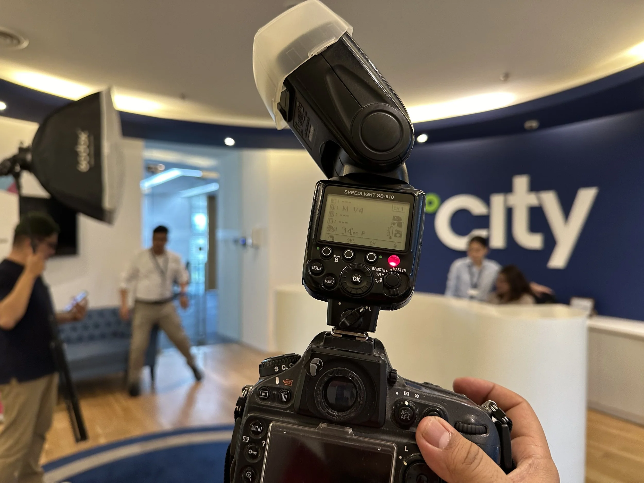 Following the team in action with a portable light and softbox – capturing authentic culture.