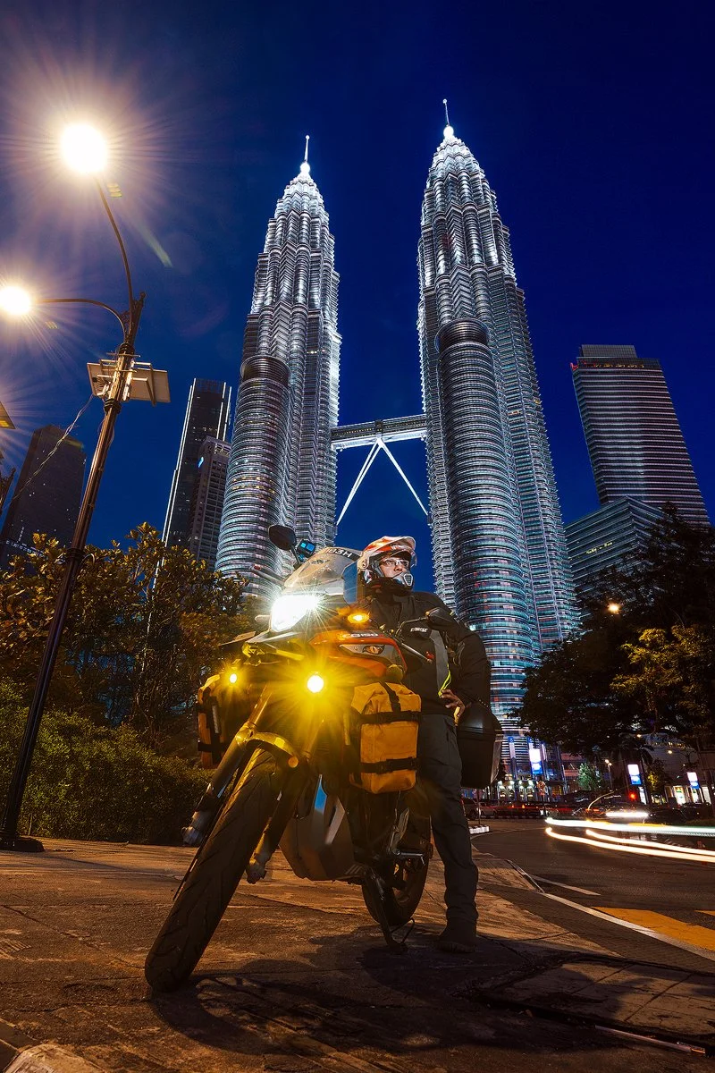Portrait of Chegu Thamrin and his Bike in front of the Petronas Towers
