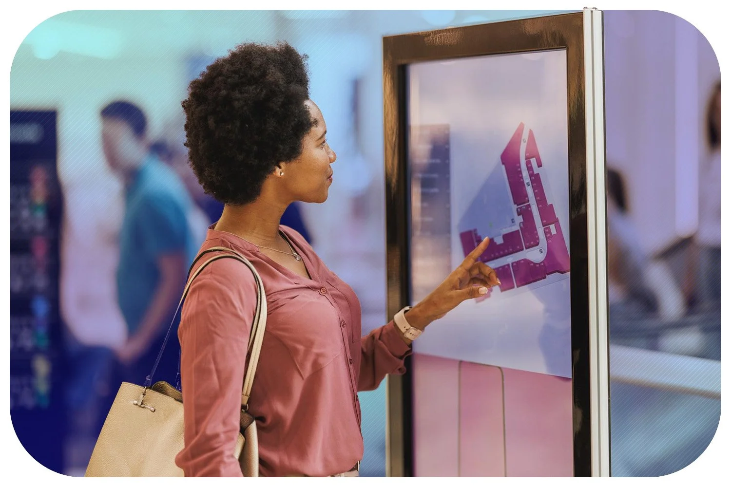 Woman using large touch screen