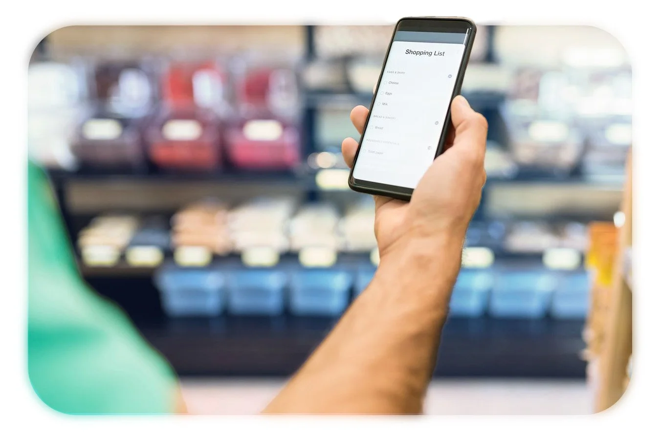 Hand holding a smartphone for scan&go usage