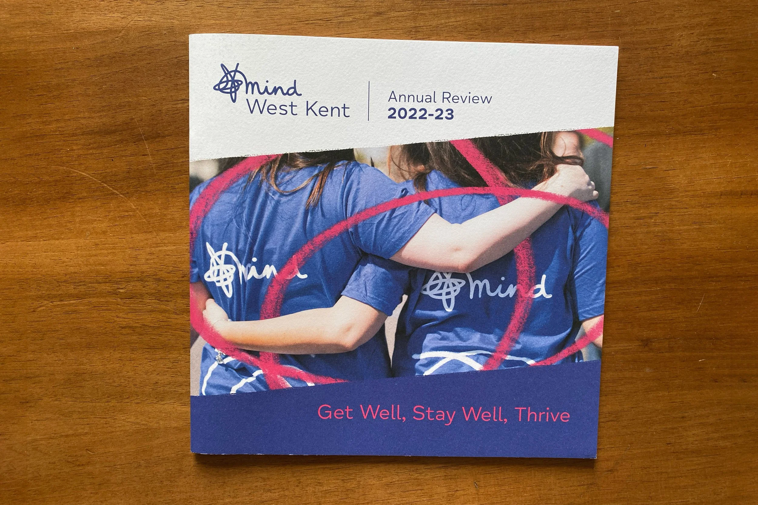 Two women wearing Mind t-shirts, hugging after sponsored race