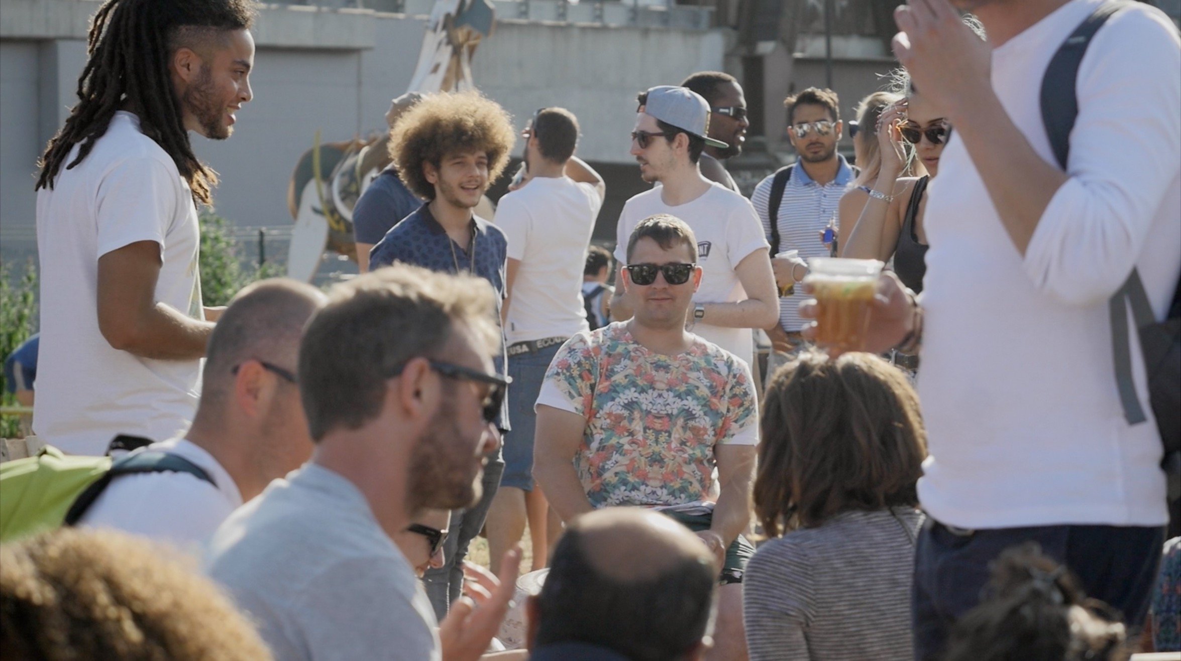 Nomadic Community Gardens documentary crowd people drinking sun.jpg