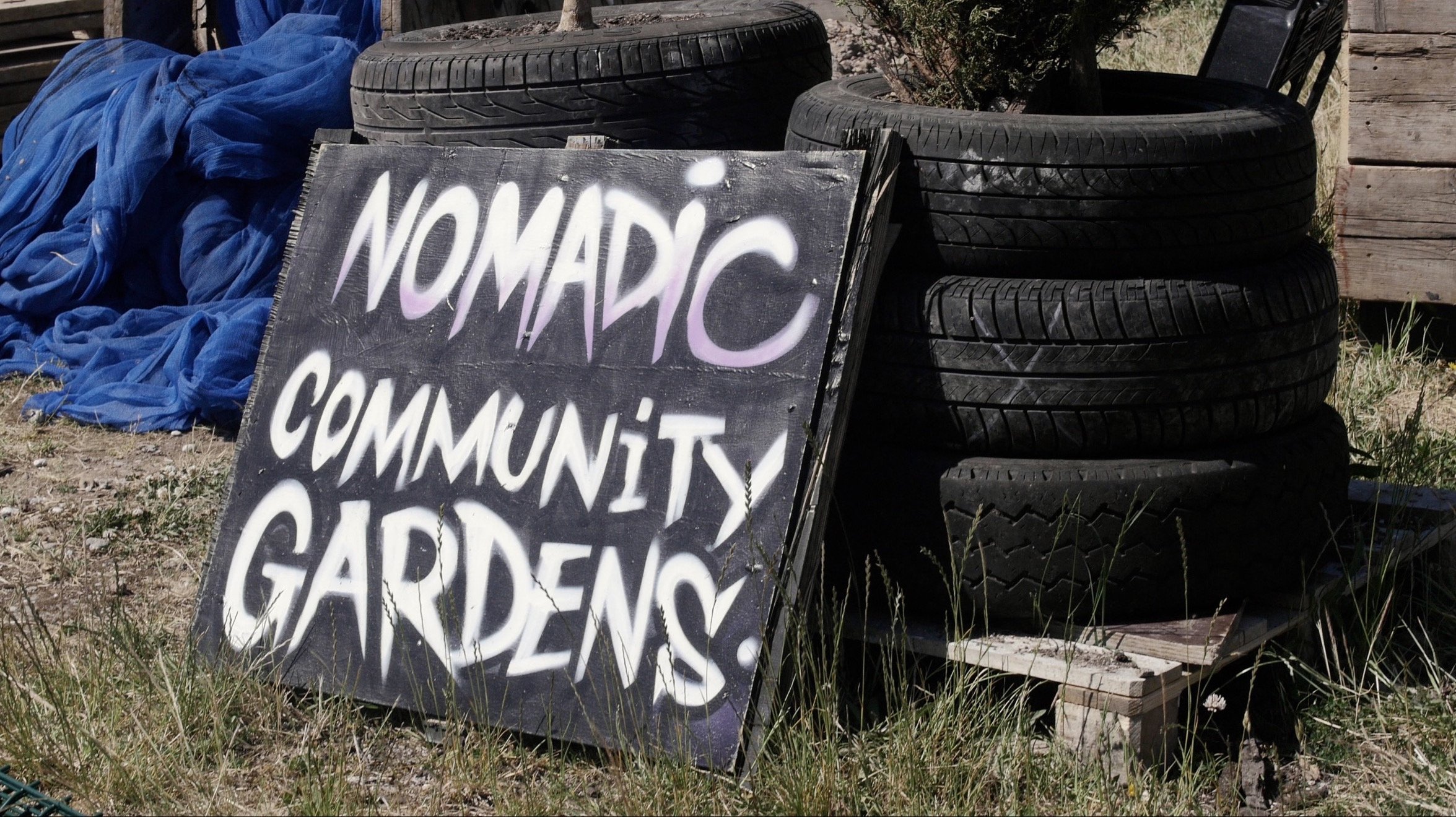 Nomadic Community Gardens writing on board.jpg
