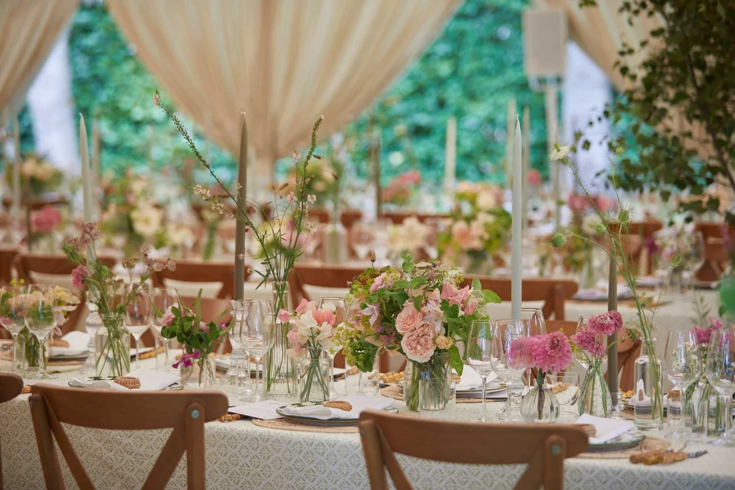 Wedding flowers inside a marquee at a wedding near Stroud