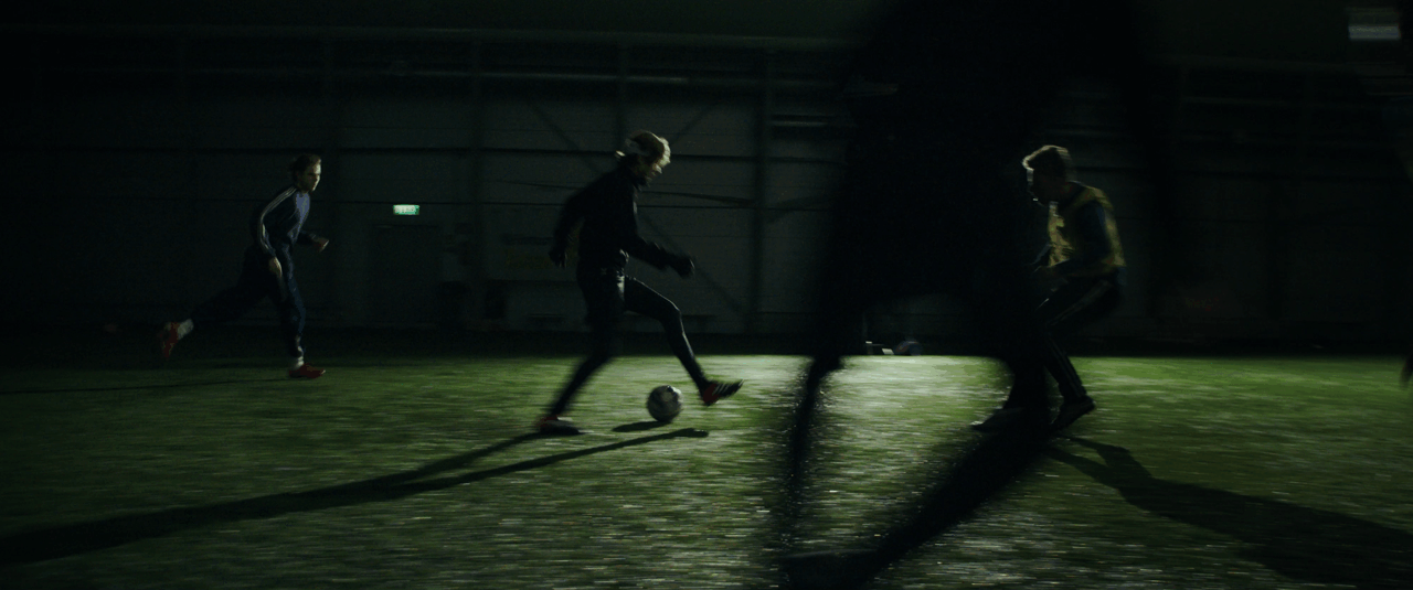 People playing soccer in an indoor sports facility