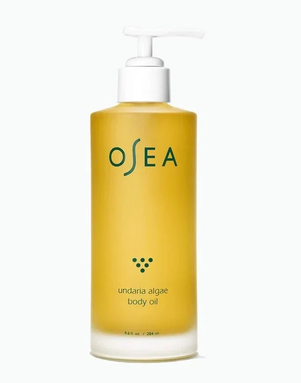 Yellow bottle of OSEA Undaria Algae Body Oil with a white pump dispenser