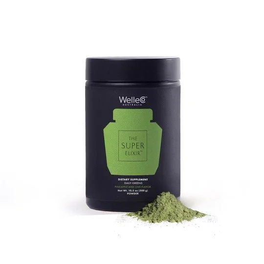 A black container labeled 'The Super Elixir' dietary supplement with a pile of green powder in front of it.
